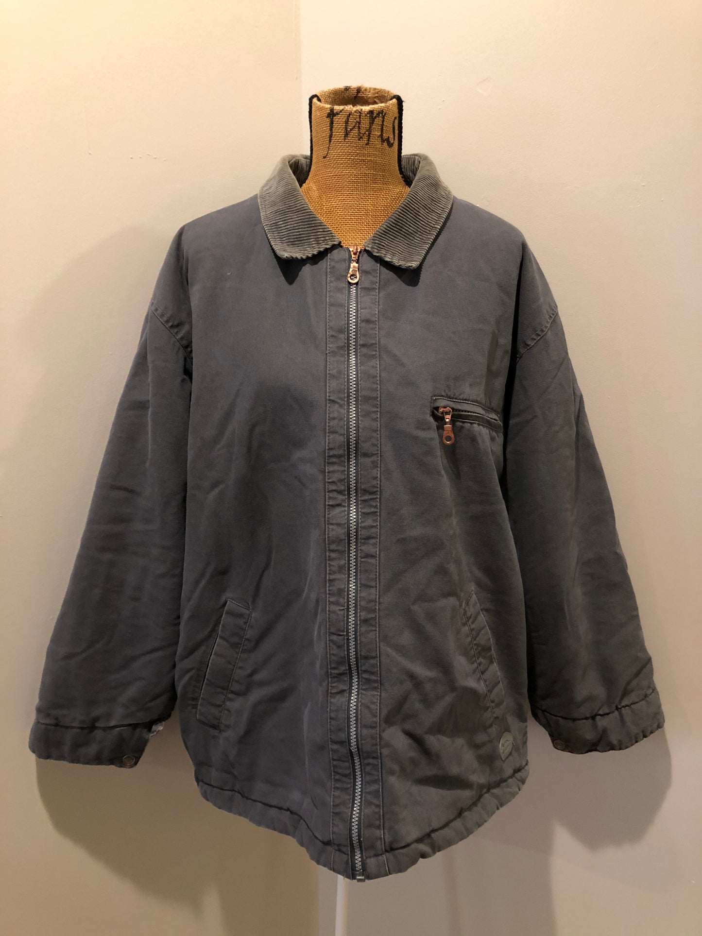 Kingspier Vintage - Dickie’s grey insulted chore jacket with grey corduroy collar, zipper closure, slash pockets, one zip pocket on the chest, one inside pocket and bright orange quilted lining. Size large.