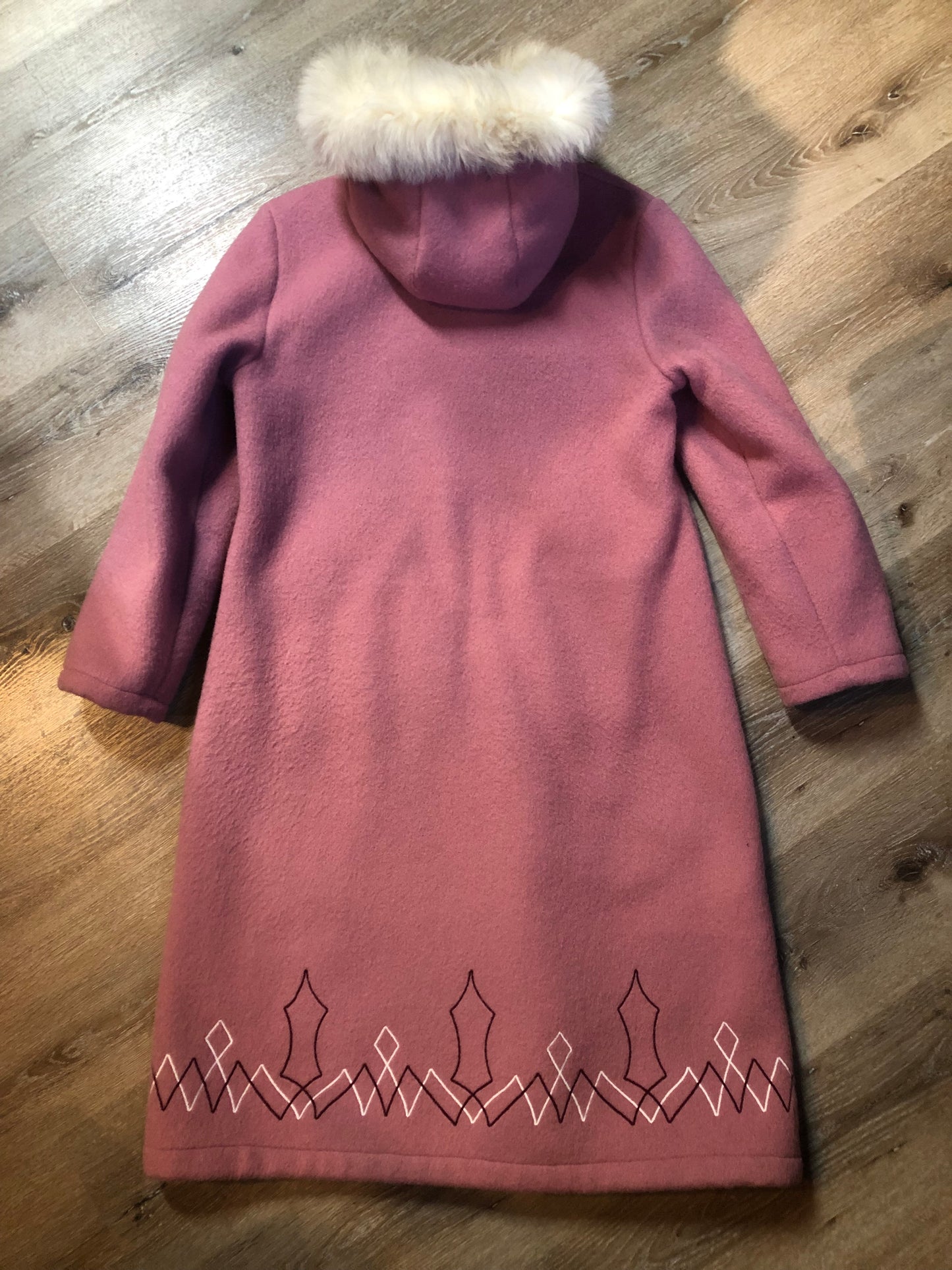 Vintage Hudson’s Bay Company pink 100% virgin wool parka with white fur trimmed hood, fur pom poms, zipper closure, patch pockets, satin lining and embroidered pattern along the hem. Made in Canada. Size 14 - Kingspier Vintage