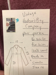 Vintage Hudson’s Bay Company pink 100% virgin wool parka with white fur trimmed hood, fur pom poms, zipper closure, patch pockets, satin lining and embroidered pattern along the hem. Made in Canada. Size 14 - Kingspier Vintage