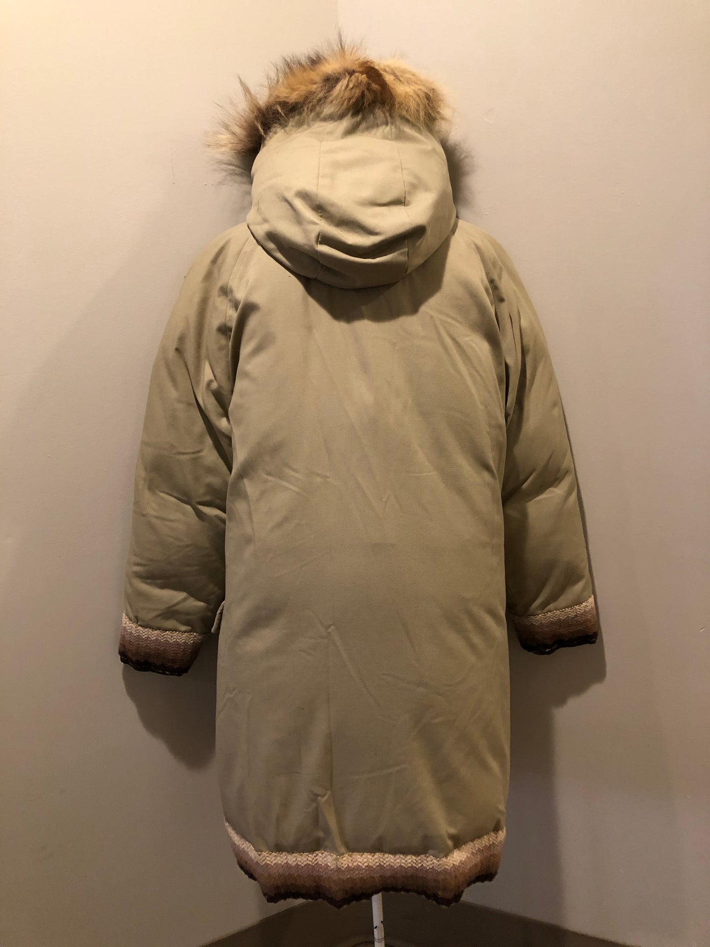 Kingspier Vintage - Vintage Rice Sportswear beige down-filled parka, with a fox fur trimmed hood. This exceptionally warm parka has embroidered ribbon detail in the cuffs and bottom hem. Parka features zipper and ribbon button closures, flap pockets and handwarmer pockets, Size medium. Made in Canada.