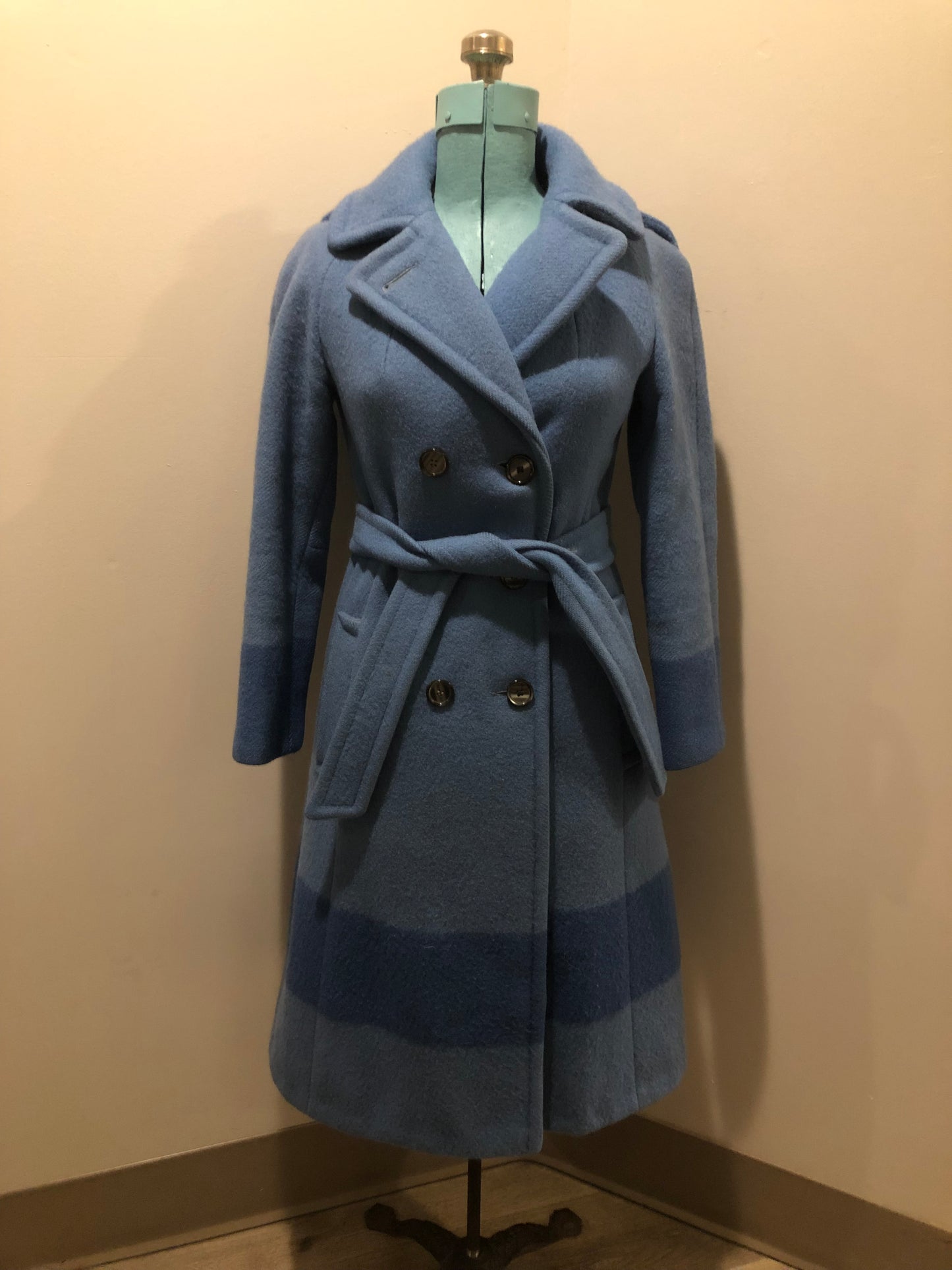 Hudson’s Bay Company Blue 100% virgin wool point blanket coat in a double breasted swing coat style with belt, detachable hood, button closures, slash pockets and satin lining. Made in Canada. Size small - Kingspier Vintage