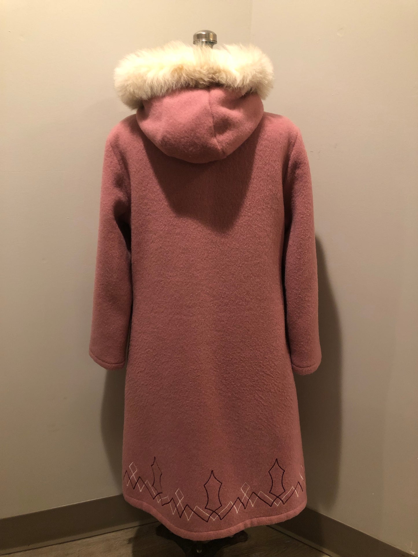 Vintage Hudson’s Bay Company pink 100% virgin wool parka with white fur trimmed hood, fur pom poms, zipper closure, patch pockets, satin lining and embroidered pattern along the hem. Made in Canada. Size 14 - Kingspier Vintage