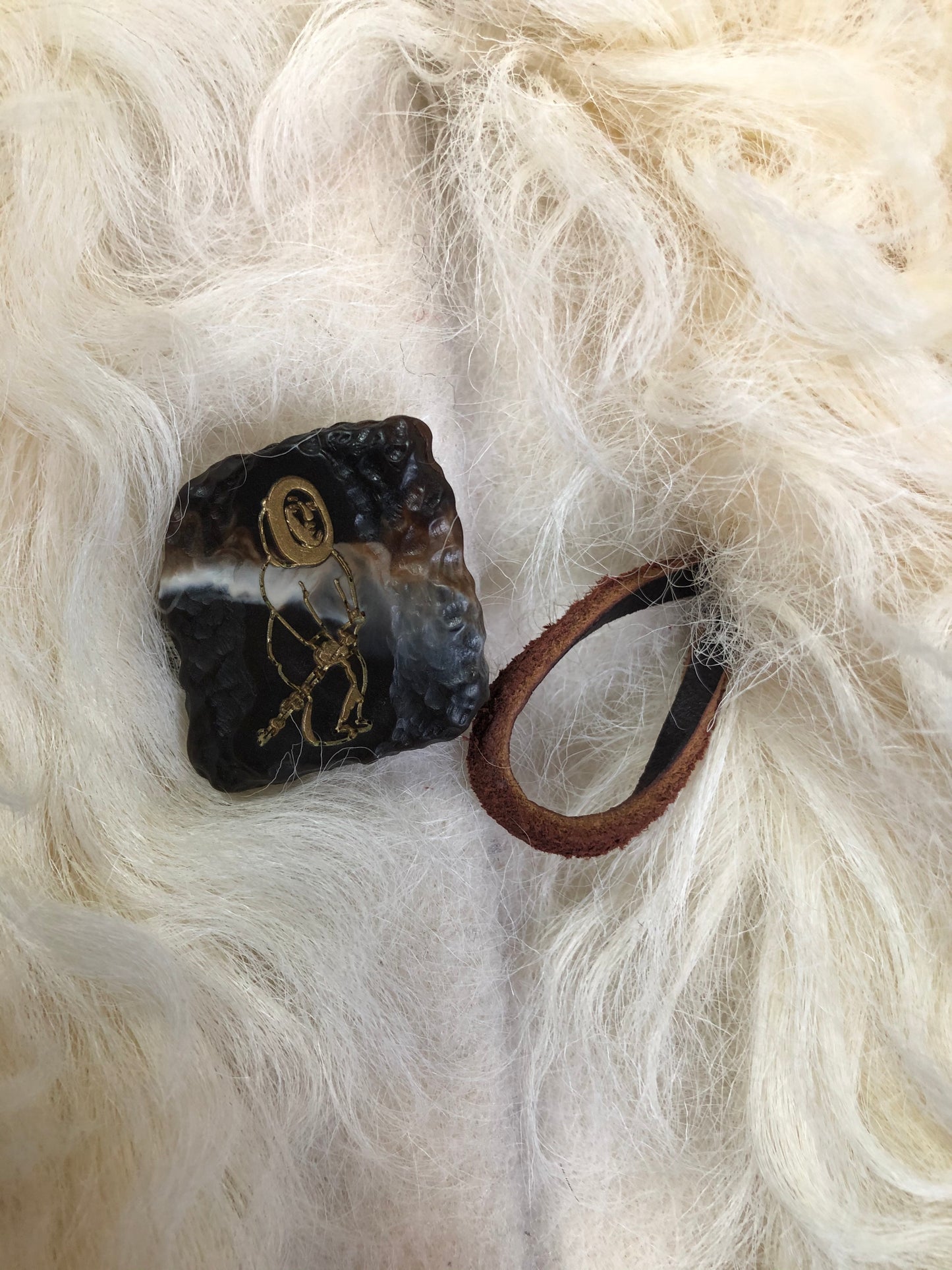 Kingspier Vintage - Vintage Mongolian sheepskin coat with soft and curly white and brown fur, pockets, pink satin lining, unique buttons and leather frog closures. Size small.