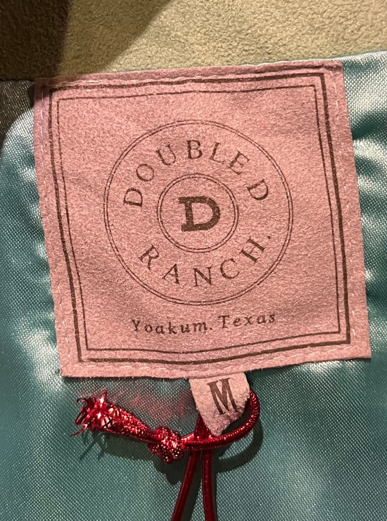 Double D Ranch light green goat suede vest with brown fringe detail, hook and eye closure, cotton/ linen back panel, satin lining and a western cowboy and desert rose design that is hand beaded.
Made in India
Size Medium