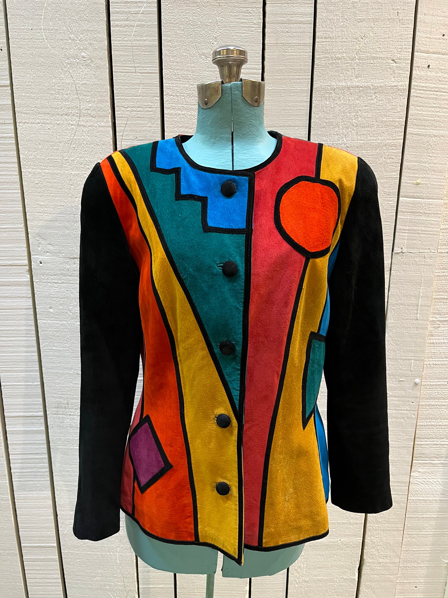 Vintage 1980’s Pia Rucci suede jacket with bright mod colour block design and
Black suede buttons.
Size 14