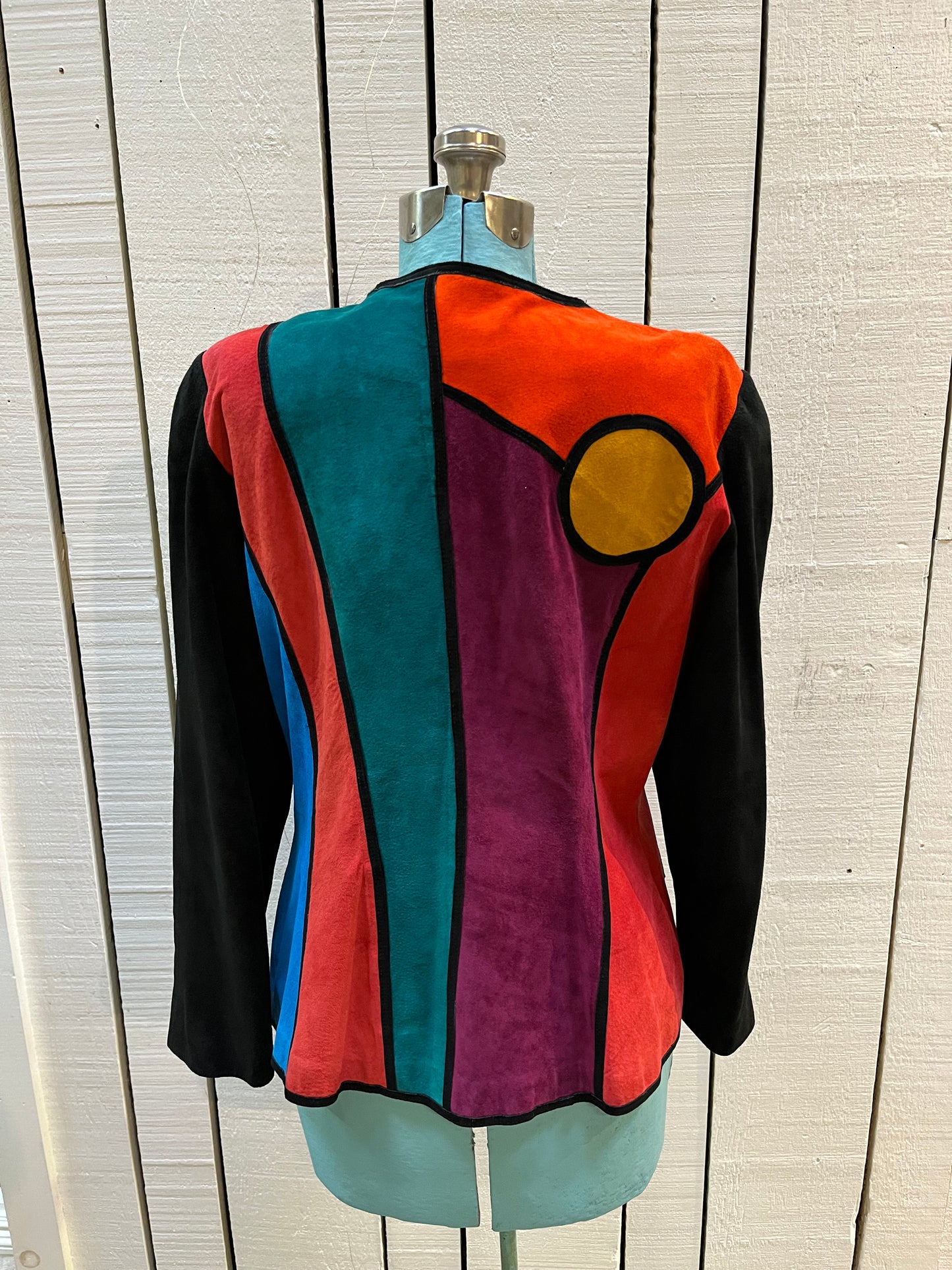 Vintage 1980’s Pia Rucci suede jacket with bright mod colour block design and
Black suede buttons.
Size 14