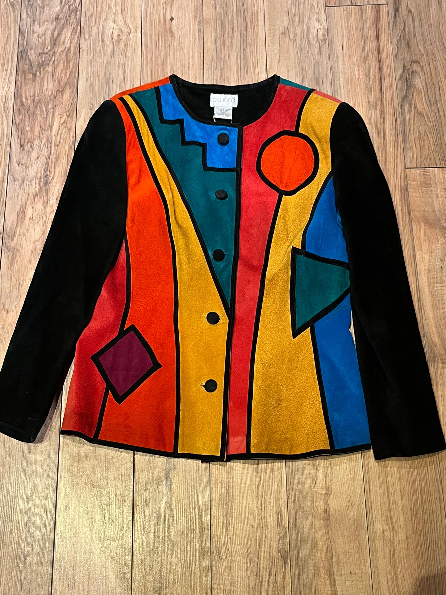 Vintage 1980’s Pia Rucci suede jacket with bright mod colour block design and
Black suede buttons.
Size 14
