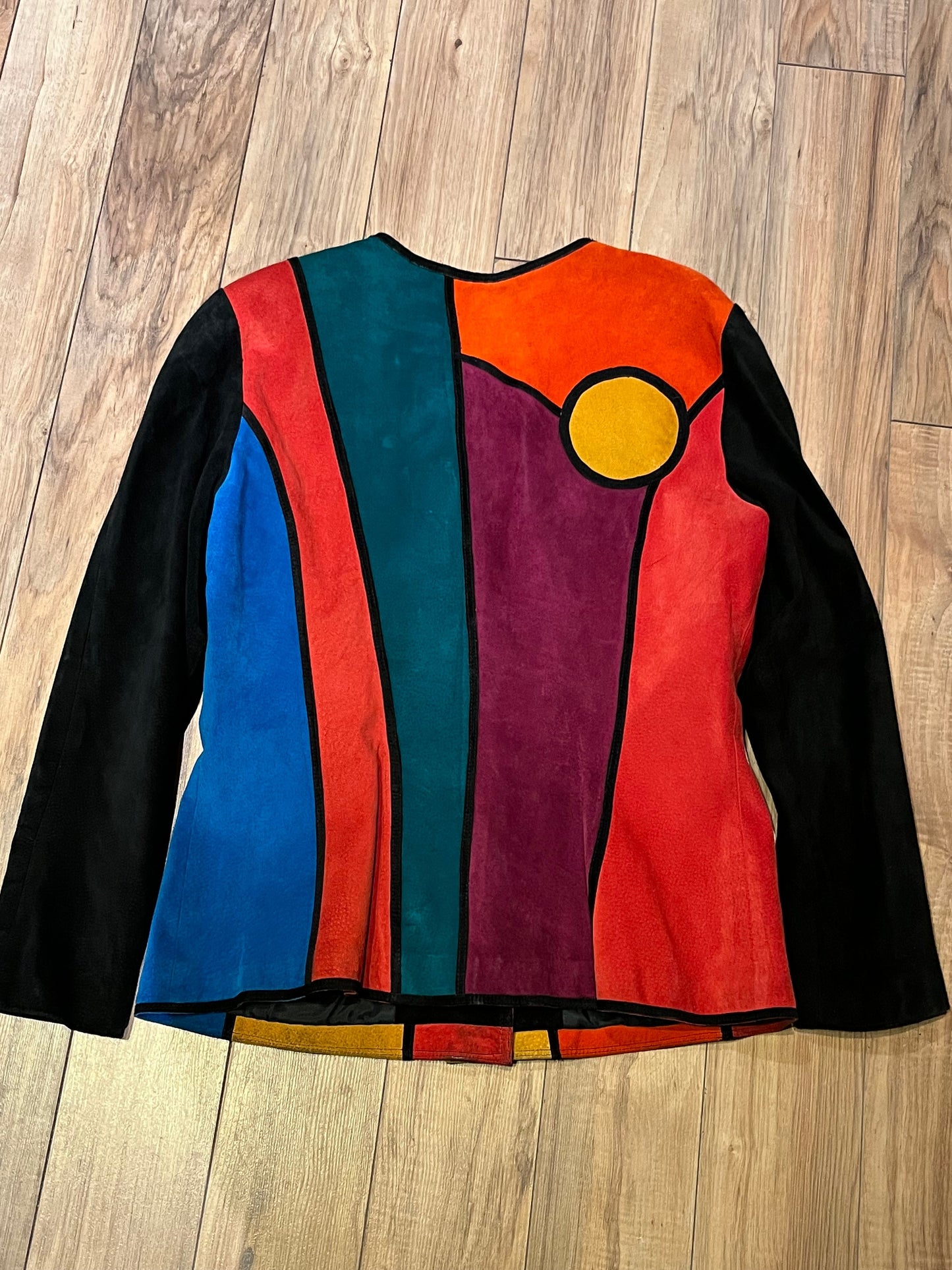 Vintage 1980’s Pia Rucci suede jacket with bright mod colour block design and
Black suede buttons.
Size 14
