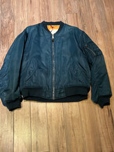 Load image into Gallery viewer, Vintage USAF Cobles Clothing Division Blue Flyer’s Man Intermediate MA. 1 Jacket. Based on original MIL-J-8279E.

100% nylon shell with polyester fill, blaze orange safety lining, zipper closure, two front slash pockets and a pocket on the left arm.

Size Medium
