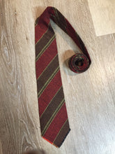 Load image into Gallery viewer, Kingspier Vintage - Au Terroira 100% wool tie with red, black, brown and green stripes. Made in Québec.

Length: 53” 
Width: 3.5”

This tie is in excellent condition.
