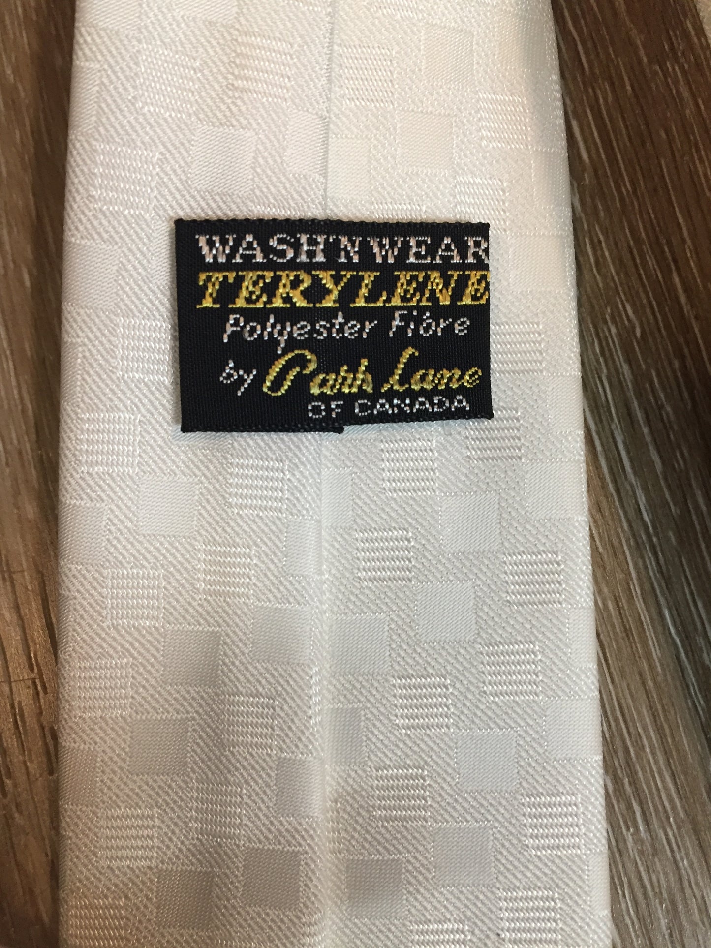 Kingspier Vintage - Park Lane of Canada “Terylene” (polyester fibre) white check tie.
Length: 52.5”
Width: 2.25”
This tie is in excellent condition.