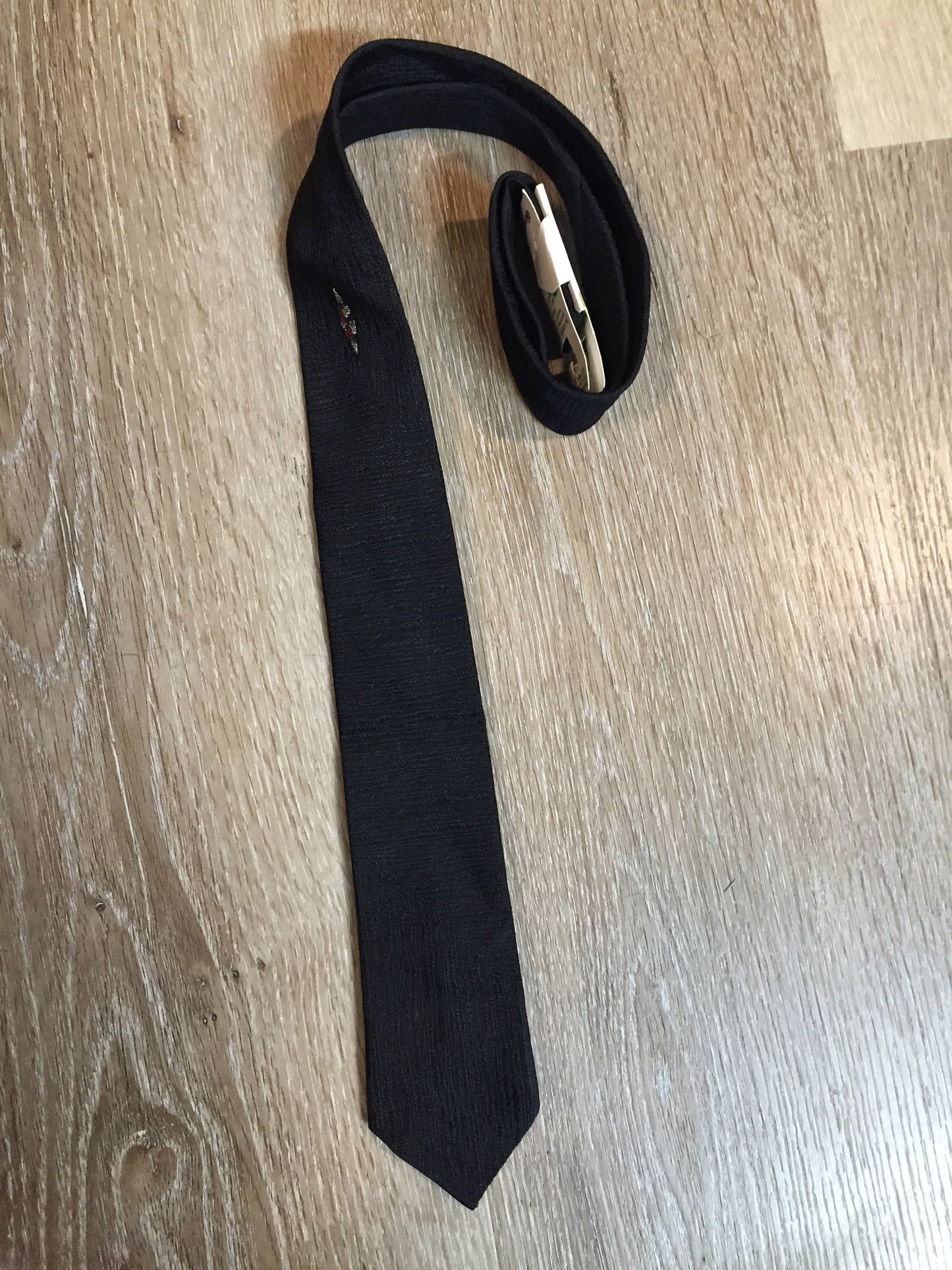 Kingspier Vintage - Gentry tie in black with red, white, yellow diamond motif. Fibres unknown.
Length: 52”
Width: 2.25” 
This tie is in excellent condition.