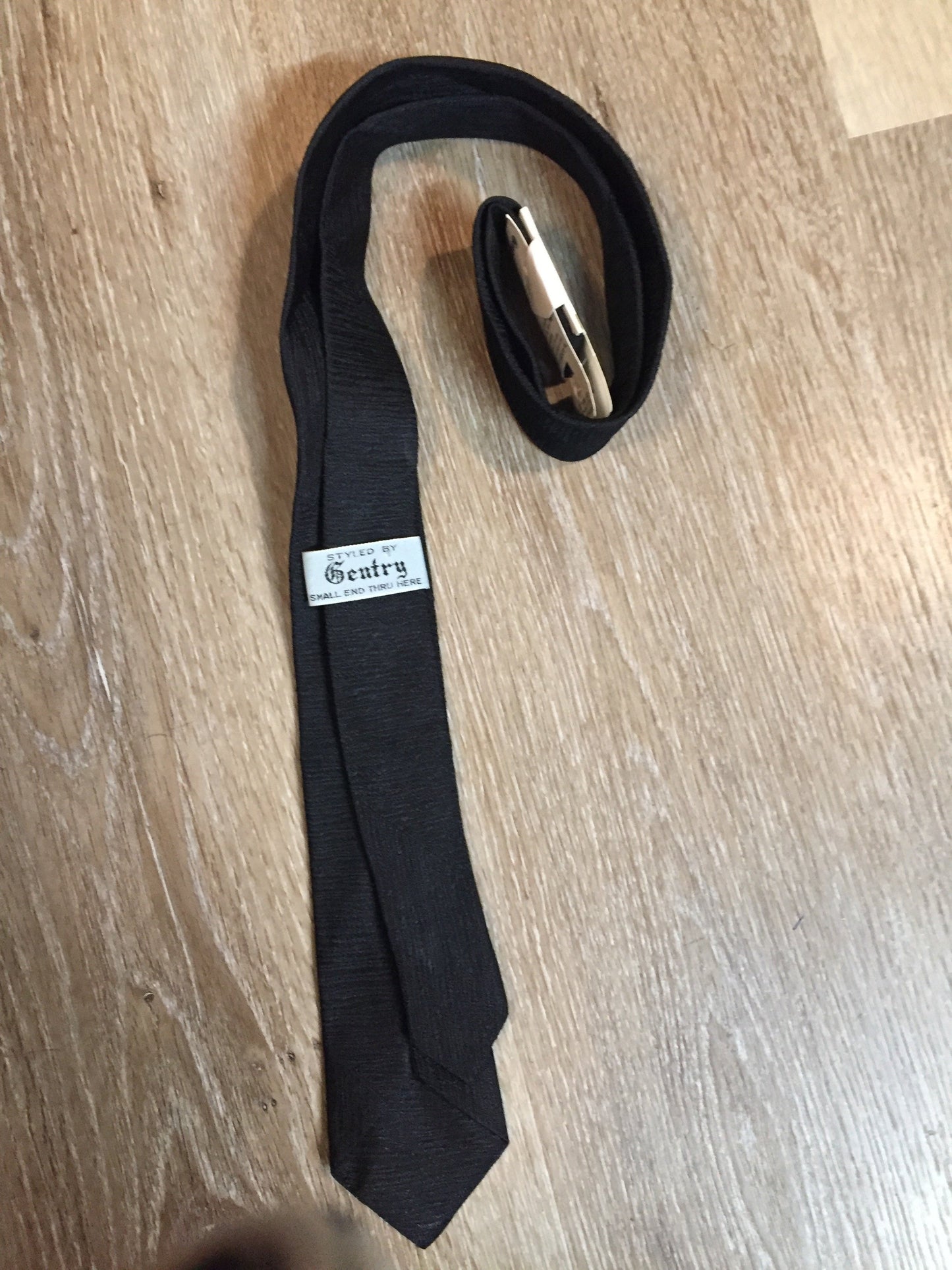 Kingspier Vintage - Gentry tie in black with red, white, yellow diamond motif. Fibres unknown.
Length: 52”
Width: 2.25” 
This tie is in excellent condition.