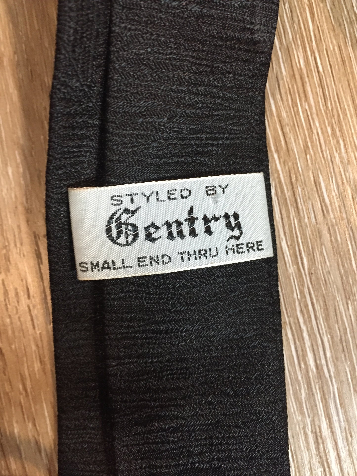 Kingspier Vintage - Gentry tie in black with red, white, yellow diamond motif. Fibres unknown.
Length: 52”
Width: 2.25” 
This tie is in excellent condition.