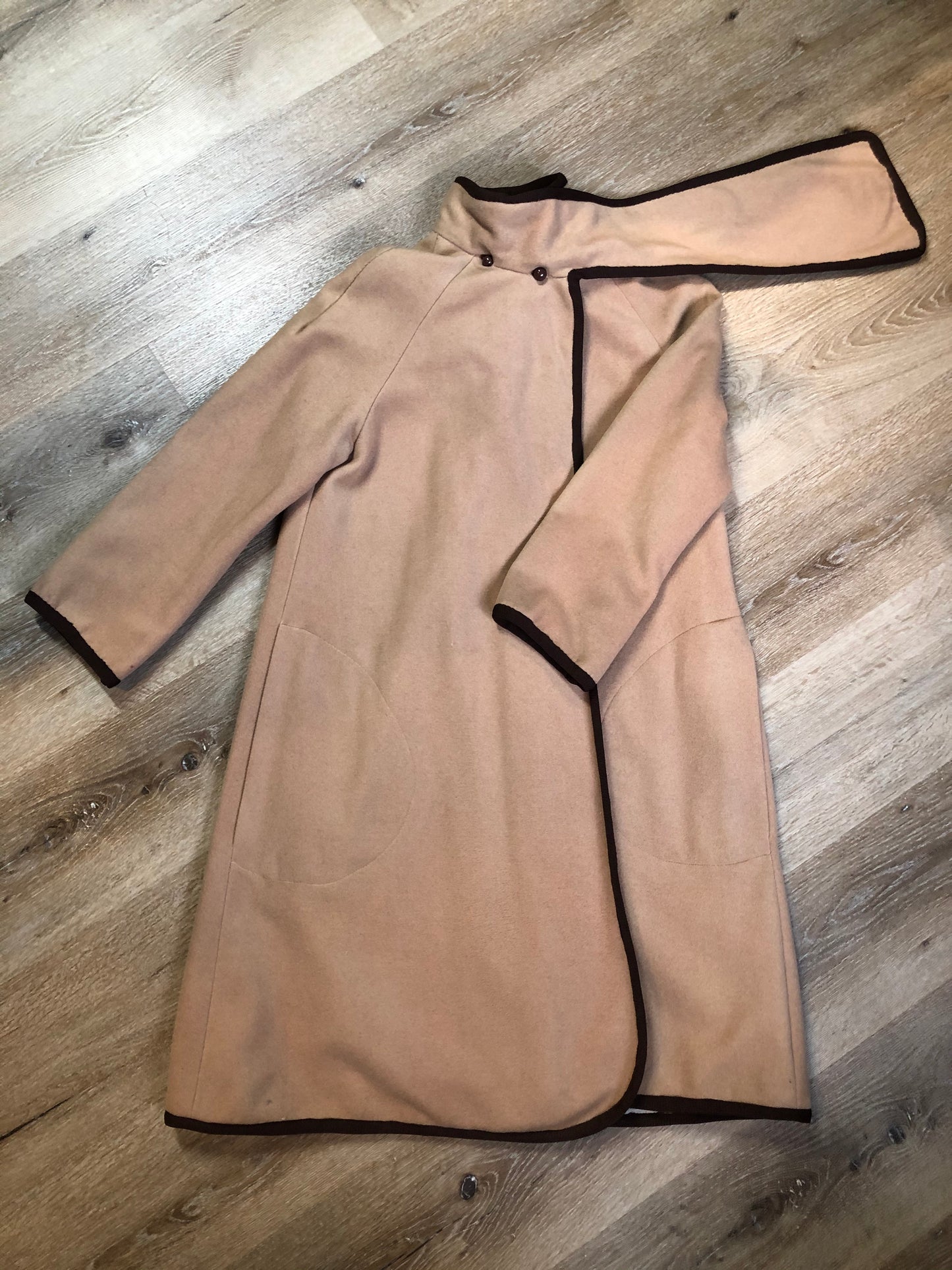 Kingspier Vintage - Handmade camel coloured cashmere cape with sleeves, attached scarf, patch pockets, two button closure at the collar and a full lining.