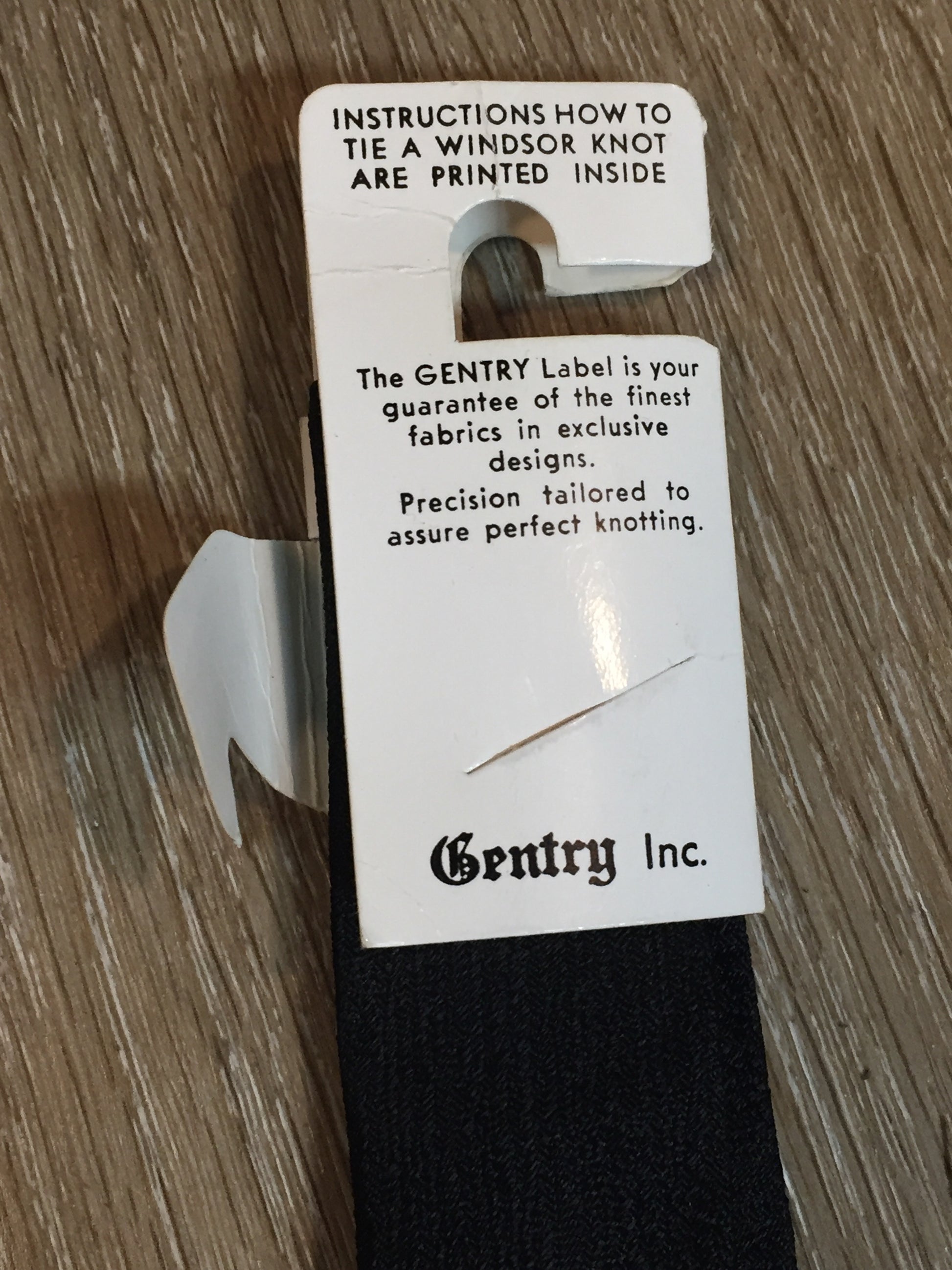 Kingspier Vintage - Gentry tie in black with red, white, yellow diamond motif. Fibres unknown.
Length: 52”
Width: 2.25” 
This tie is in excellent condition.