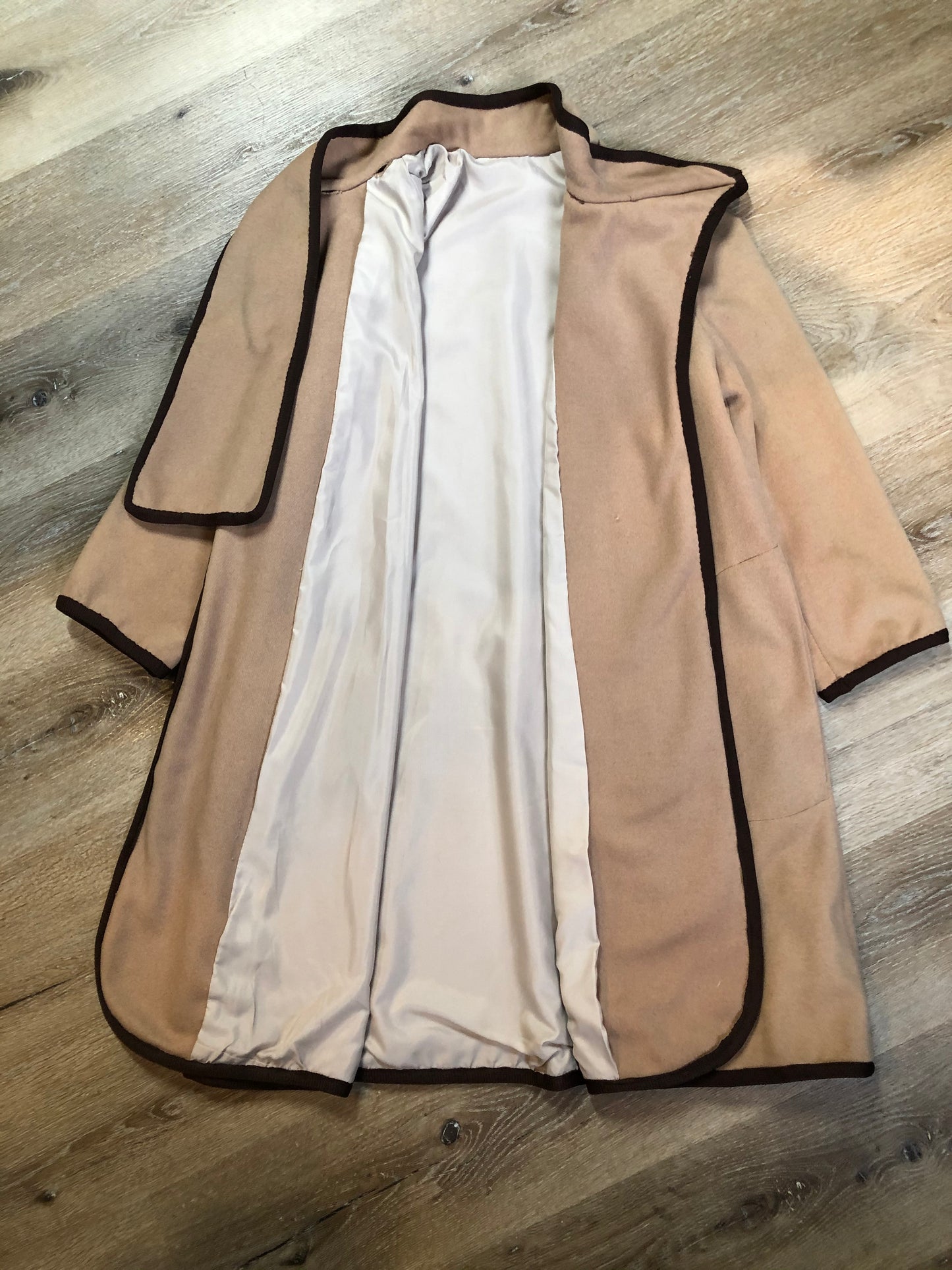Kingspier Vintage - Handmade camel coloured cashmere cape with sleeves, attached scarf, patch pockets, two button closure at the collar and a full lining.