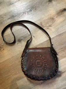 Vintage full grain brown leather crossbody bag with leather stitching, hand tooled designs and flap closure.  Made in Brazil - Kingspier Vintage