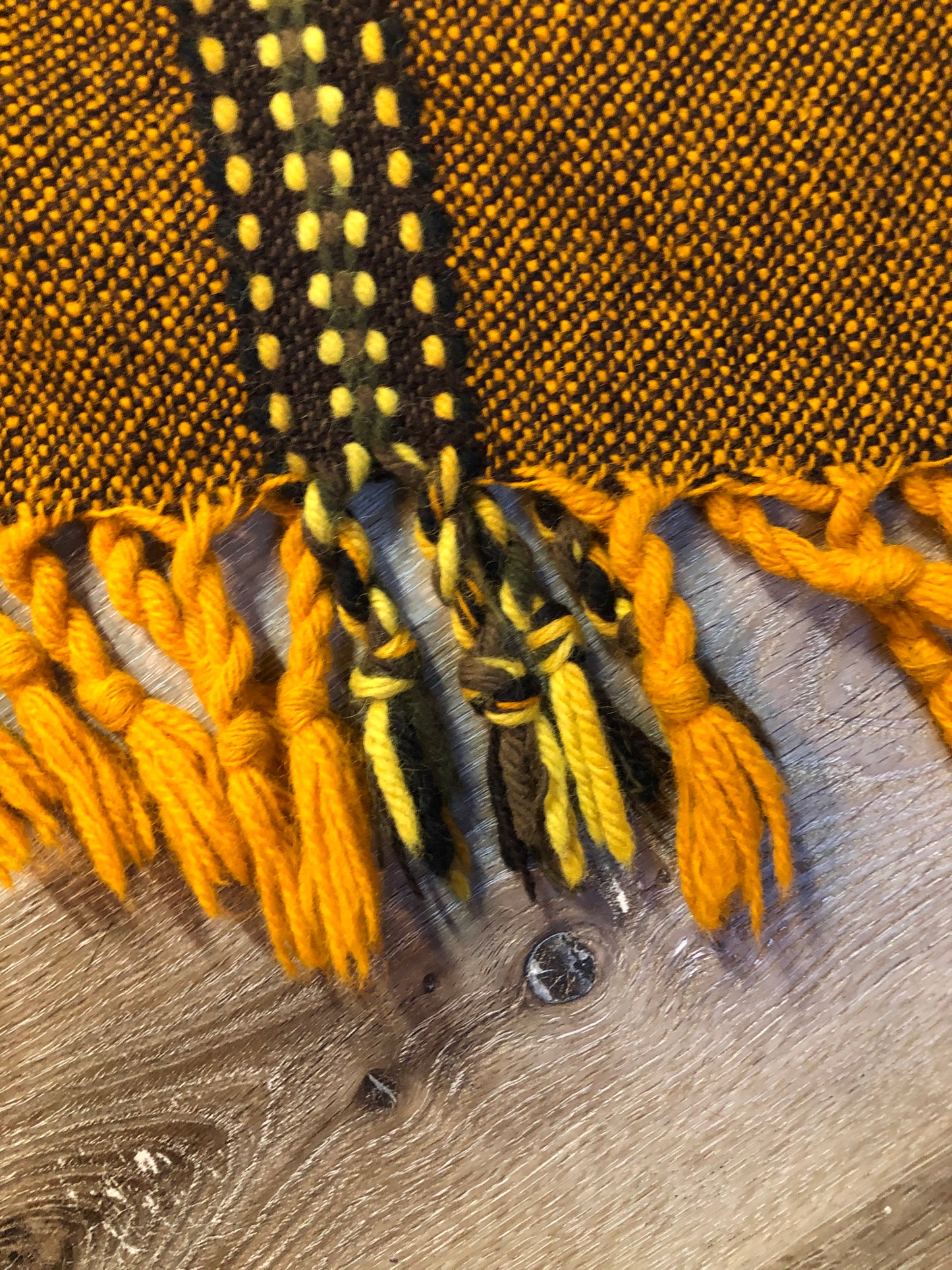 Kingspier Vintage - Vintage wool poncho with yellow, orange and brown designs and tassels on the bottom