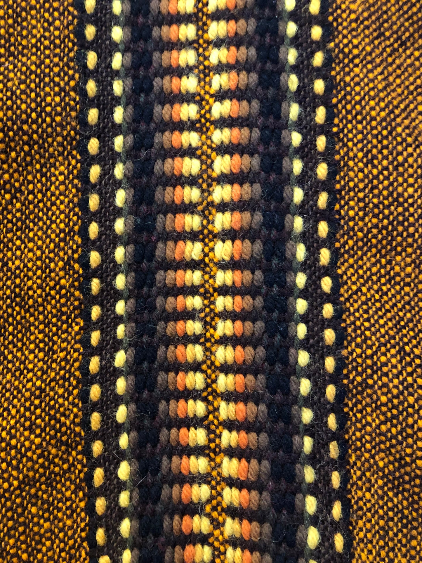 Kingspier Vintage - Vintage wool poncho with yellow, orange and brown designs and tassels on the bottom