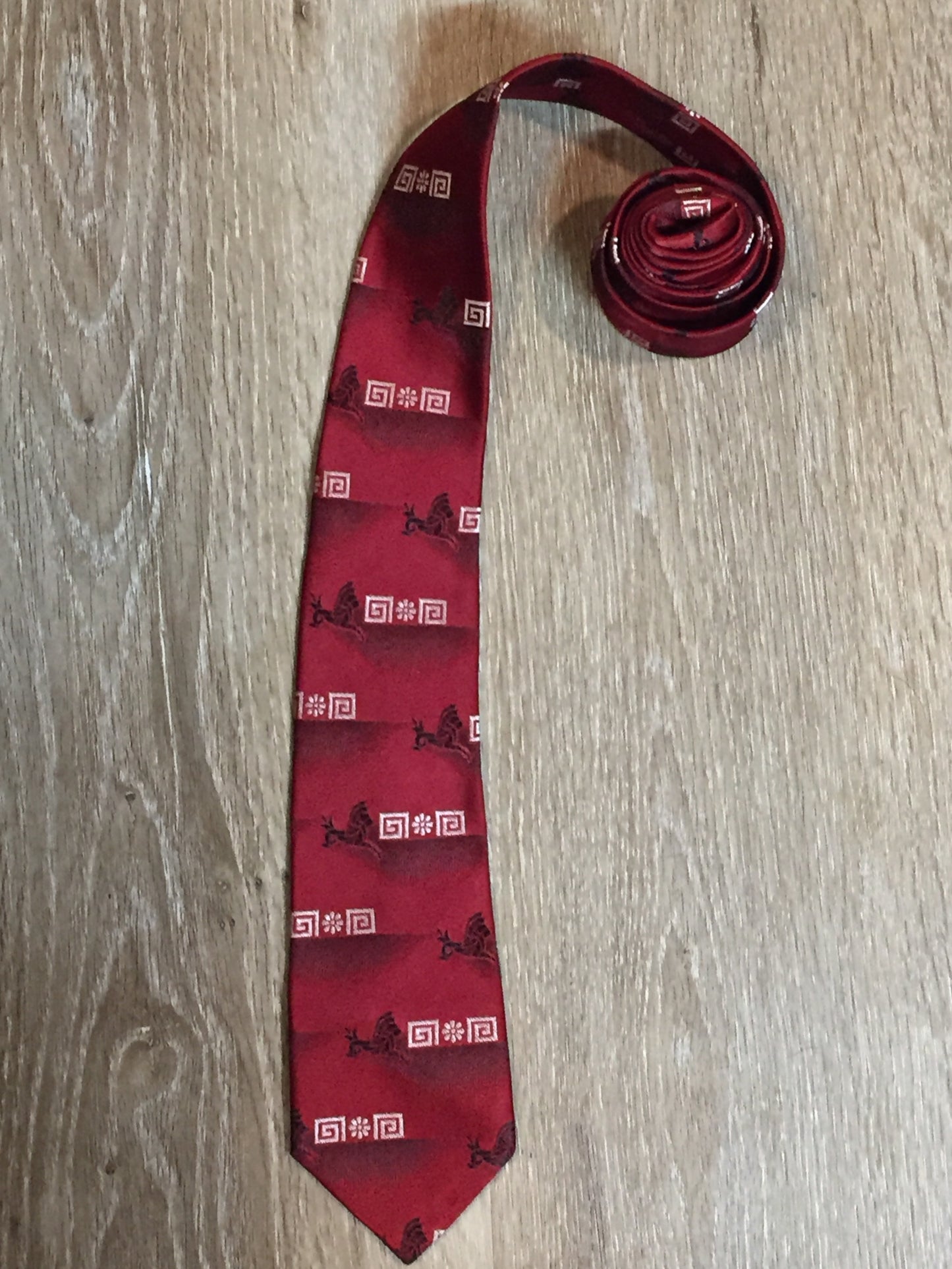 Kingspier Vintage - Gentry tie with red, black and white design. Fibres unknown.
Length: 55”
Width: 3” 
This tie is in excellent condition.