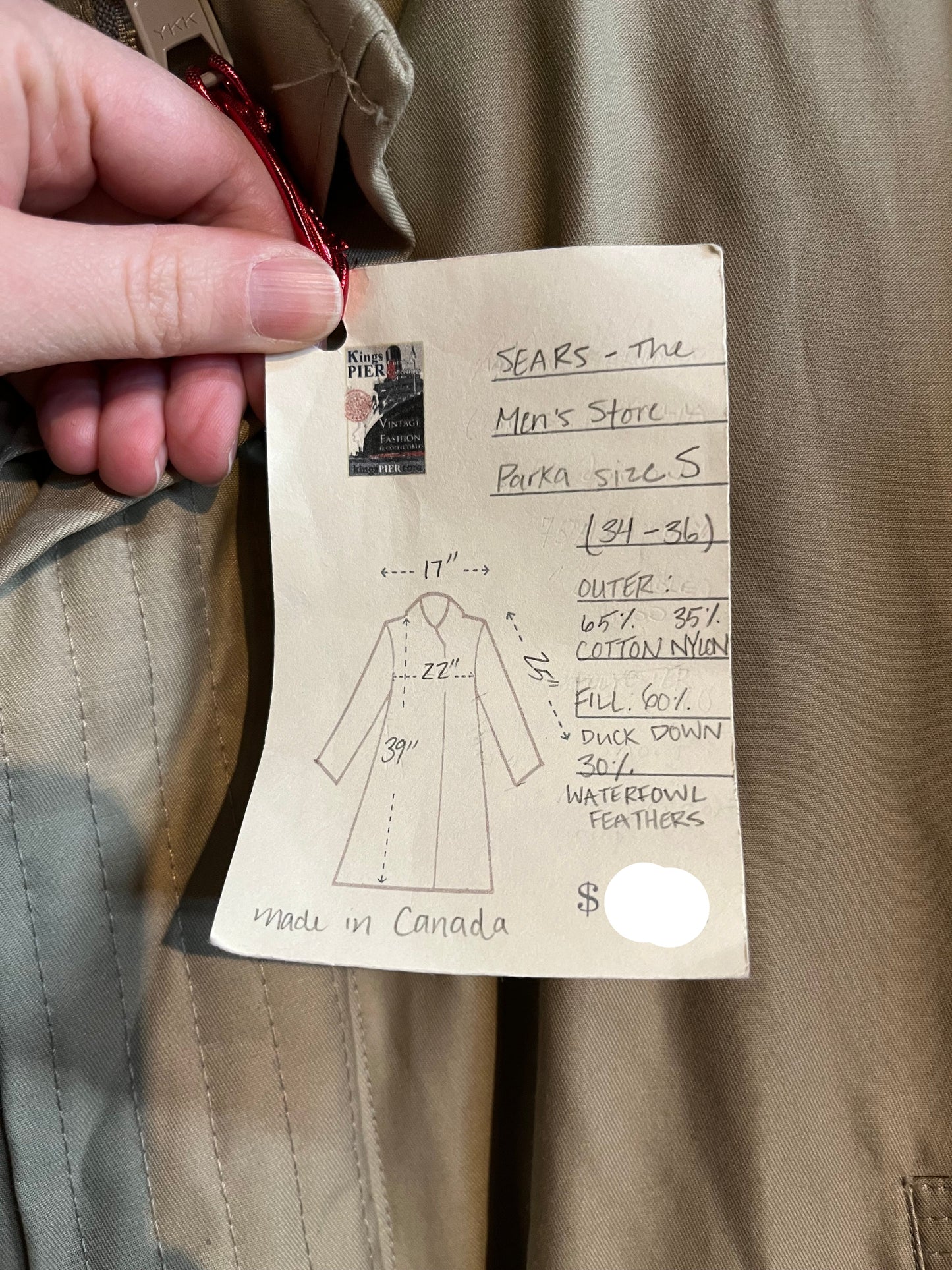 Vintage Sears “The Mens Store” beige down-filled parka (60% duck down/ 40% waterfowl feather) with cotton/nylon blend shell, zipper and button closures, two hand-warmer pockets, two flap pockets, two inside zip pockets, hood with fur trim and storm cuffs.
Made in Canada
Size Small 34-36