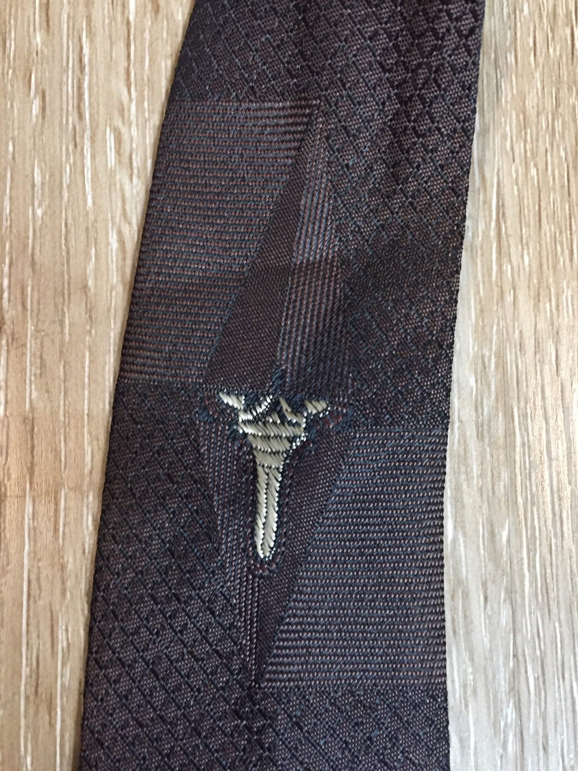 Kingspier Vintage - A Todd by Abbey tie with brown and black design. Fibres unknown.
Length: 56”
Width: 2.5”
This tie is in excellent condition.