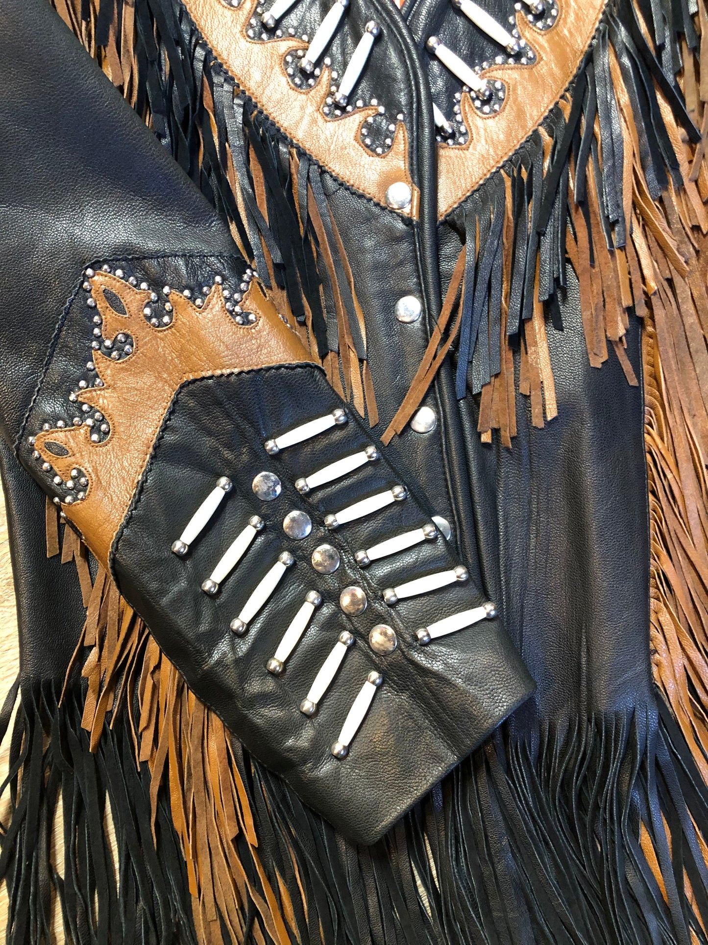Kingspier Vintage - Sheen black leather jacket with fringe and beaded detail. Made in the USA. Size large.