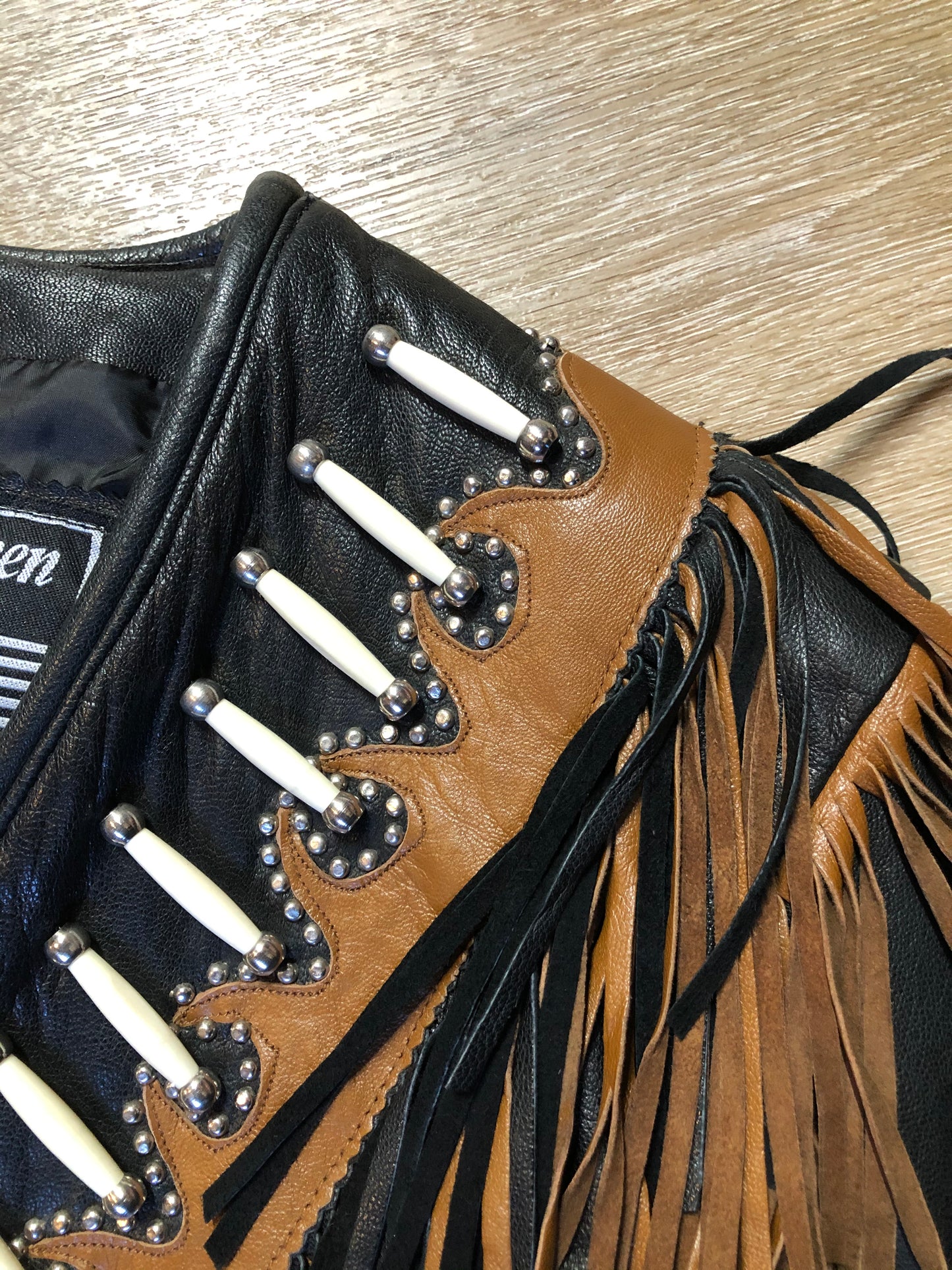 Kingspier Vintage - Sheen black leather jacket with fringe and beaded detail. Made in the USA. Size large.