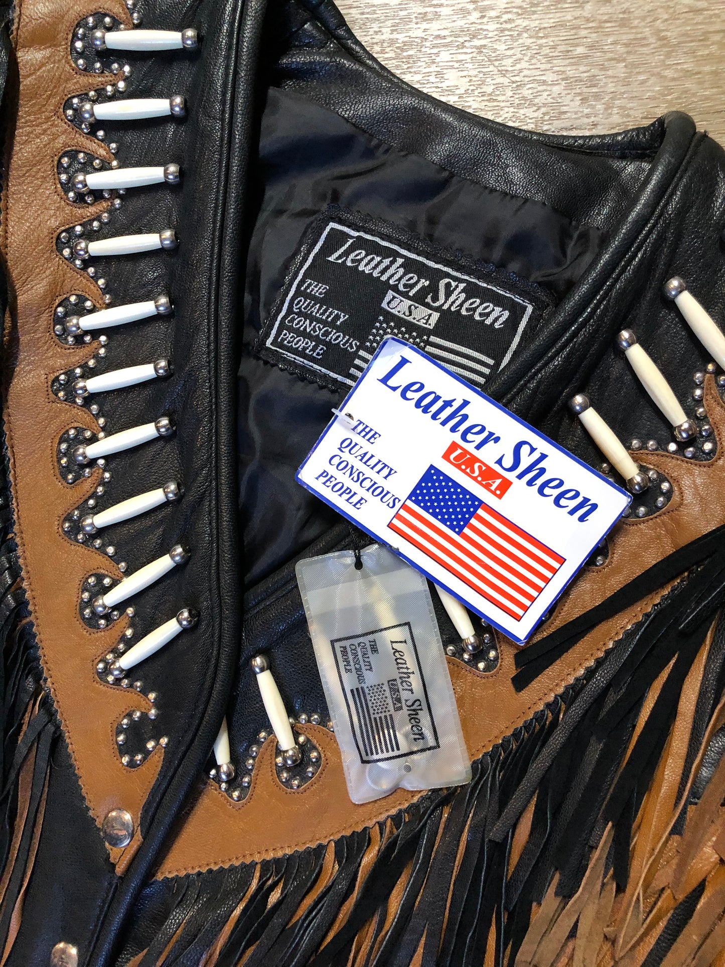 Kingspier Vintage - Sheen black leather jacket with fringe and beaded detail. Made in the USA. Size large.
