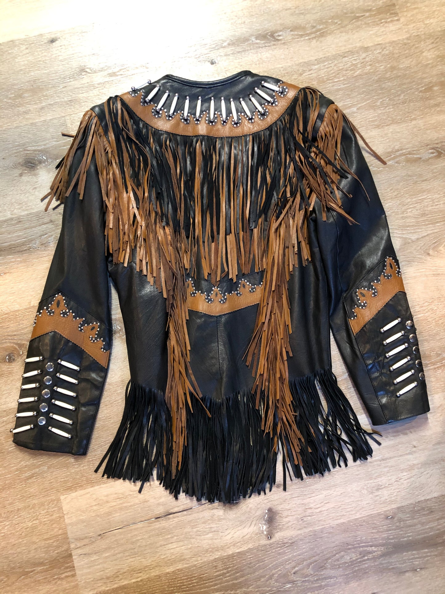 Kingspier Vintage - Sheen black leather jacket with fringe and beaded detail. Made in the USA. Size large.