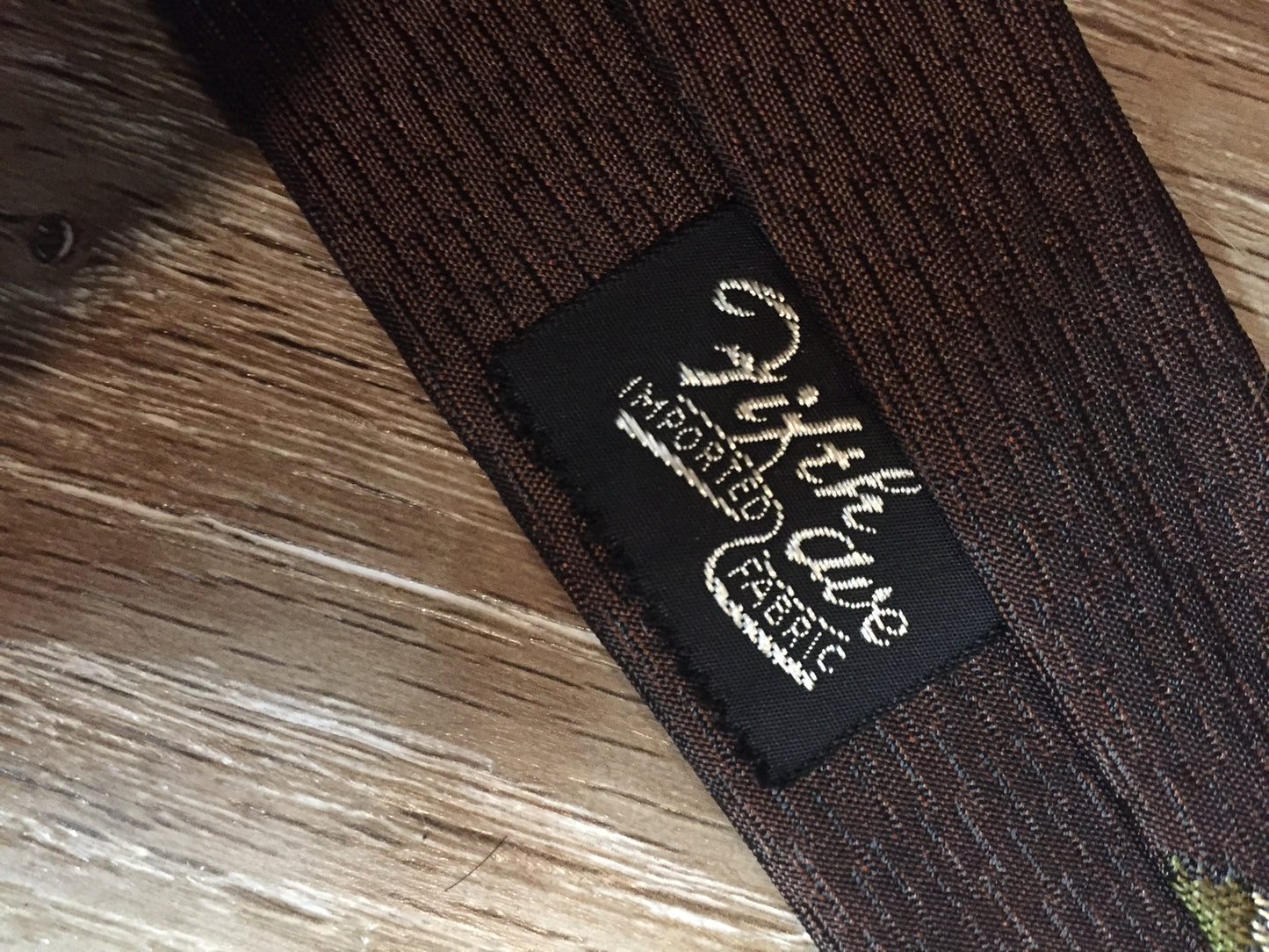 Kingspier Vintage - Fifth Avenue brown tie with white, green and brown diamond motif. Fibres unknown.
Length: 57” 
Width: 2.25” 
This tie is in excellent condition.