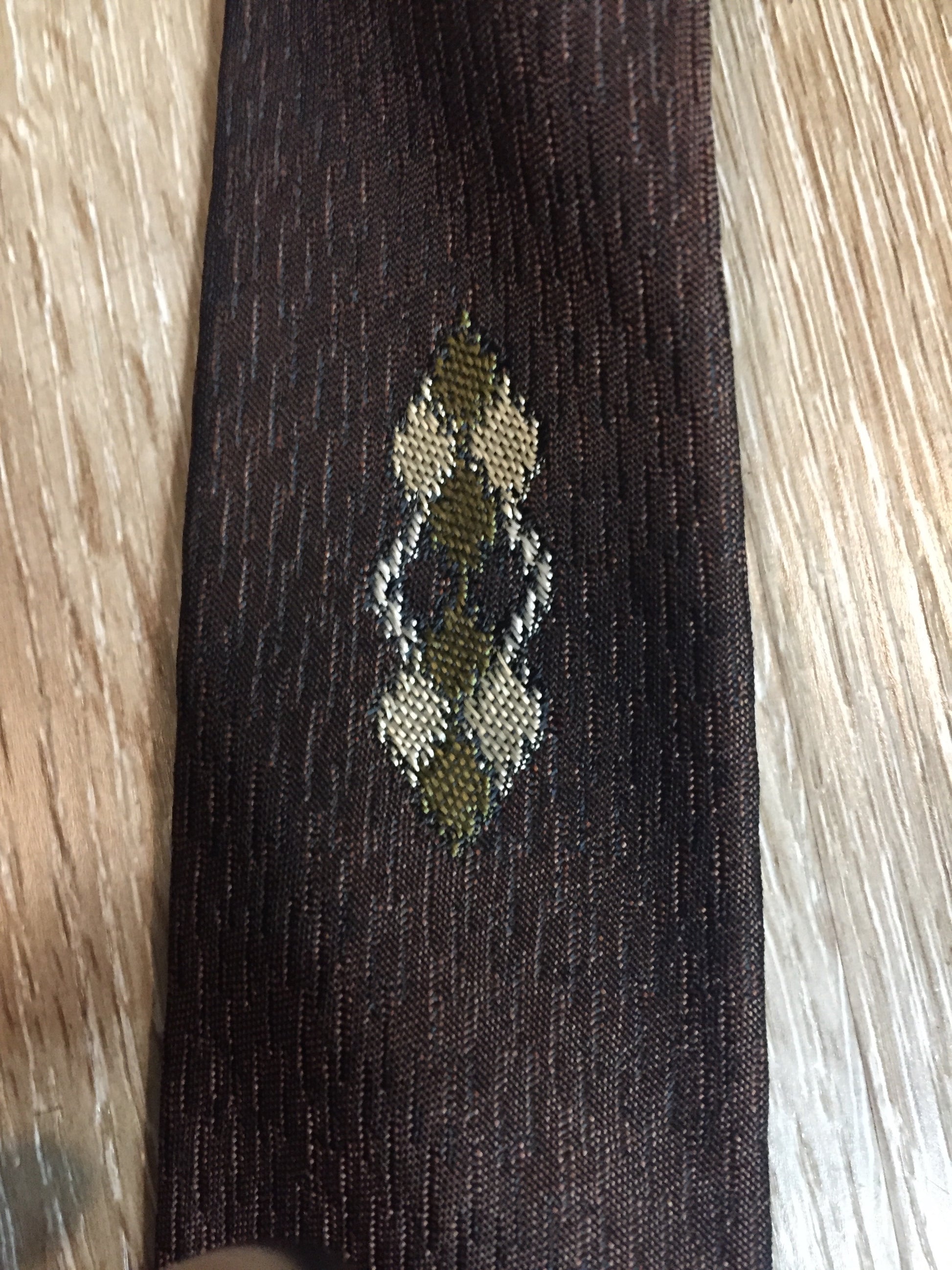 Kingspier Vintage - Fifth Avenue brown tie with white, green and brown diamond motif. Fibres unknown.
Length: 57” 
Width: 2.25” 
This tie is in excellent condition.