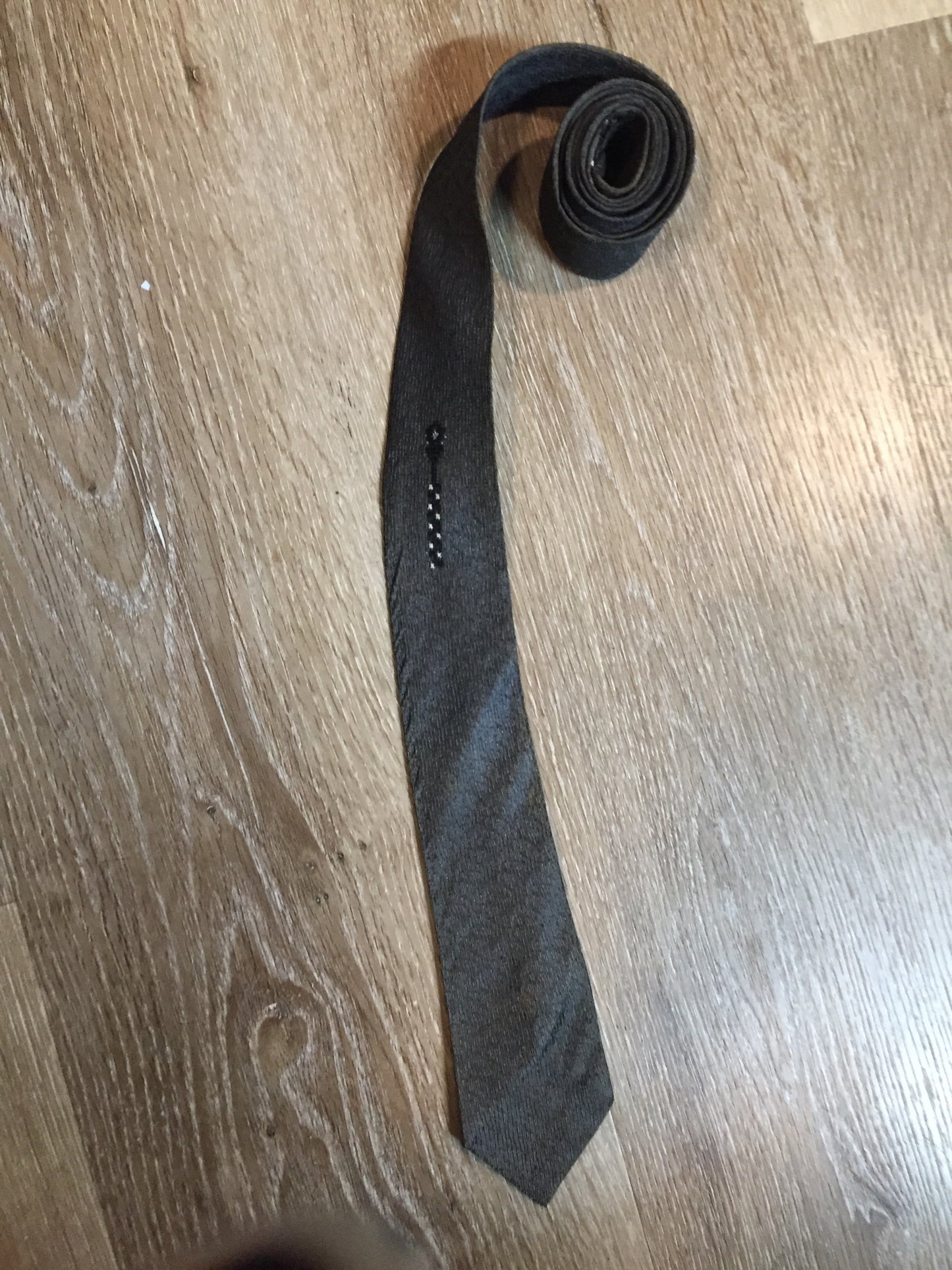 Kingspier Vintage - Abbey tie with grey, black and white pattern. Fibres unknown.
Length: 56” 
Width: 2.25” 
This tie is in excellent condition with some yellowing/ sun damage.