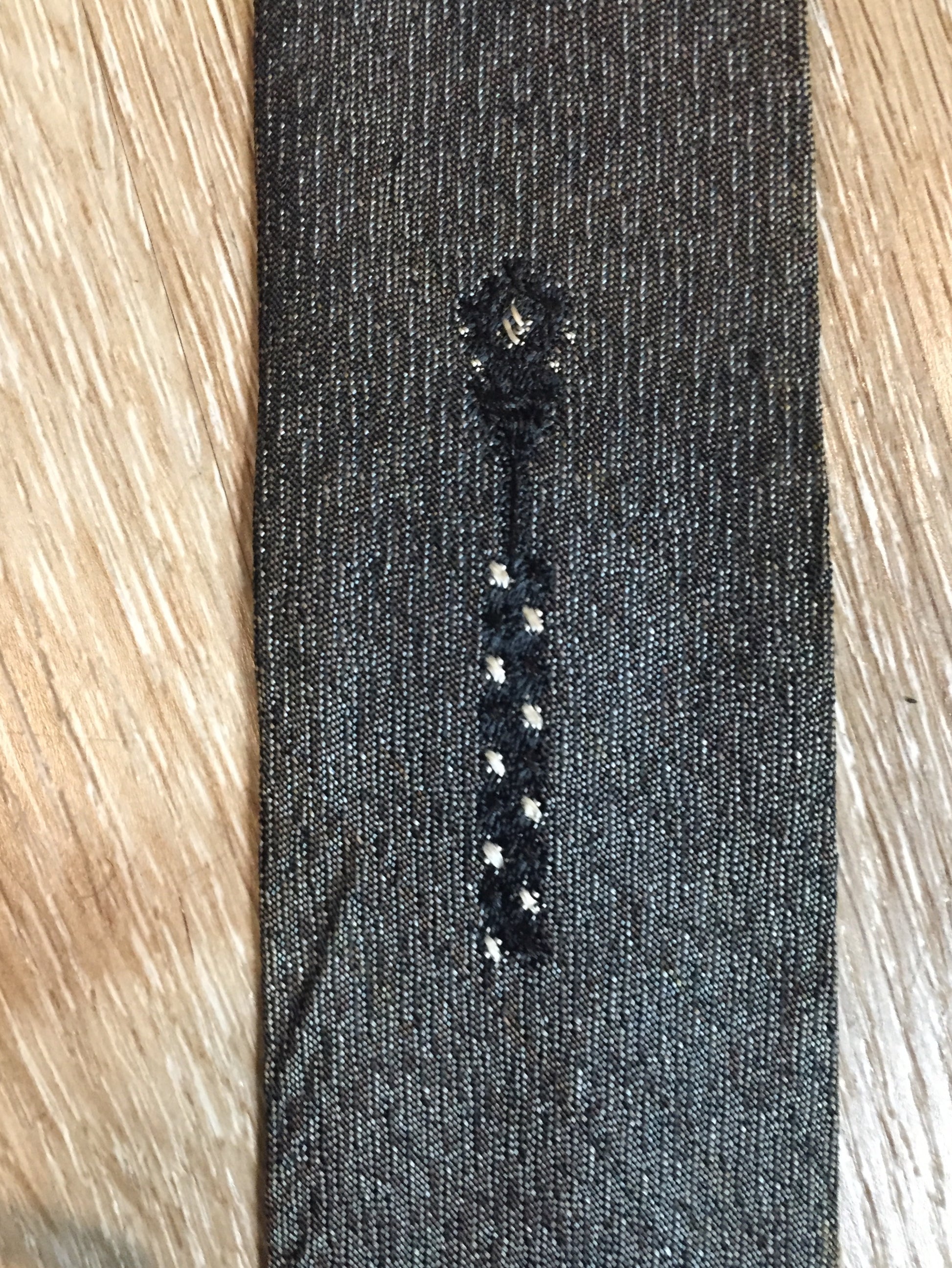 Kingspier Vintage - Abbey tie with grey, black and white pattern. Fibres unknown.
Length: 56” 
Width: 2.25” 
This tie is in excellent condition with some yellowing/ sun damage.