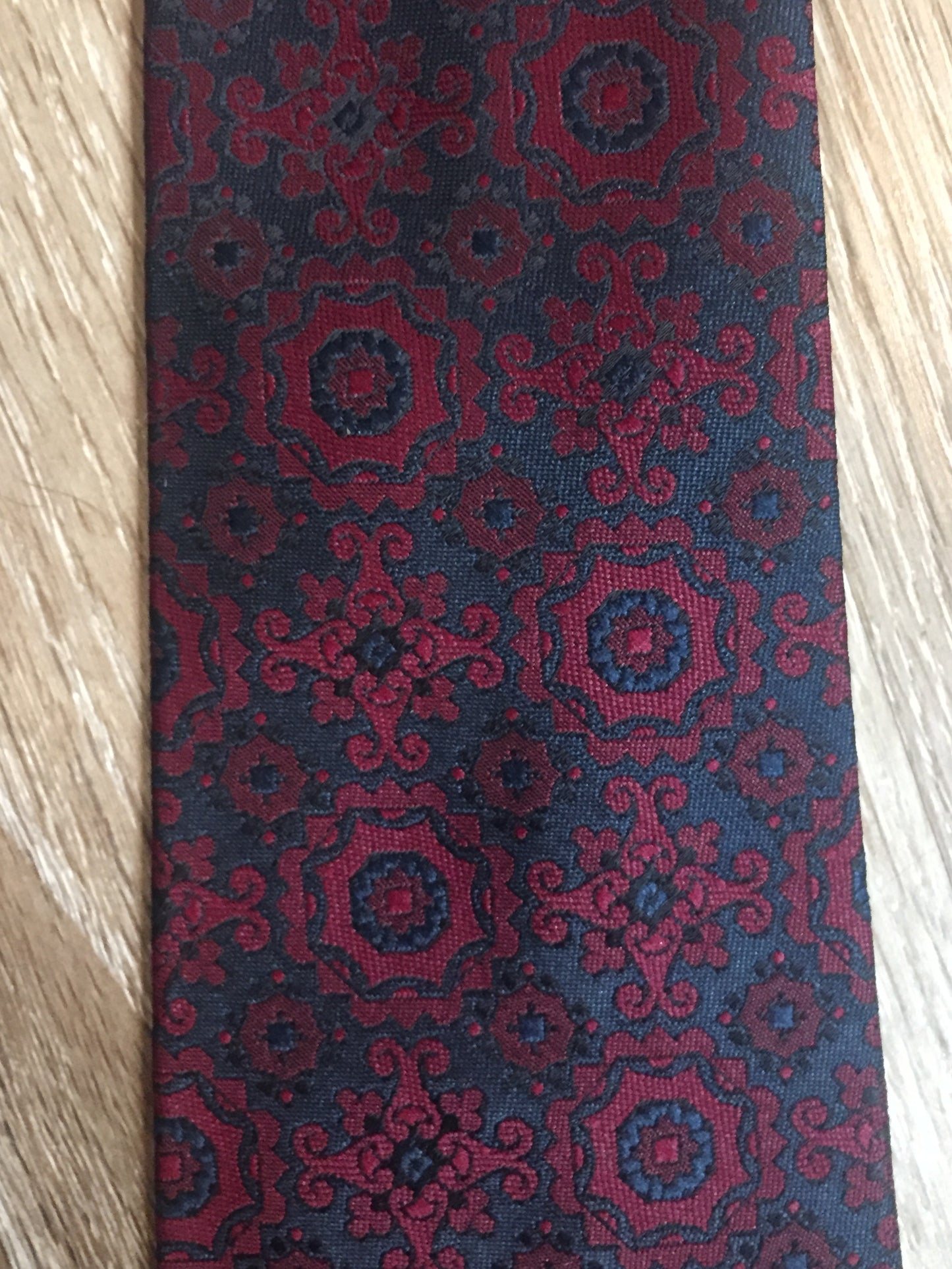 Kingspier Vintage - Harvey Gold tie in red and navy paisley design. Fibres unknown.
Length: 52.5” 
Width: 2.75” 
This tie is in excellent condition.