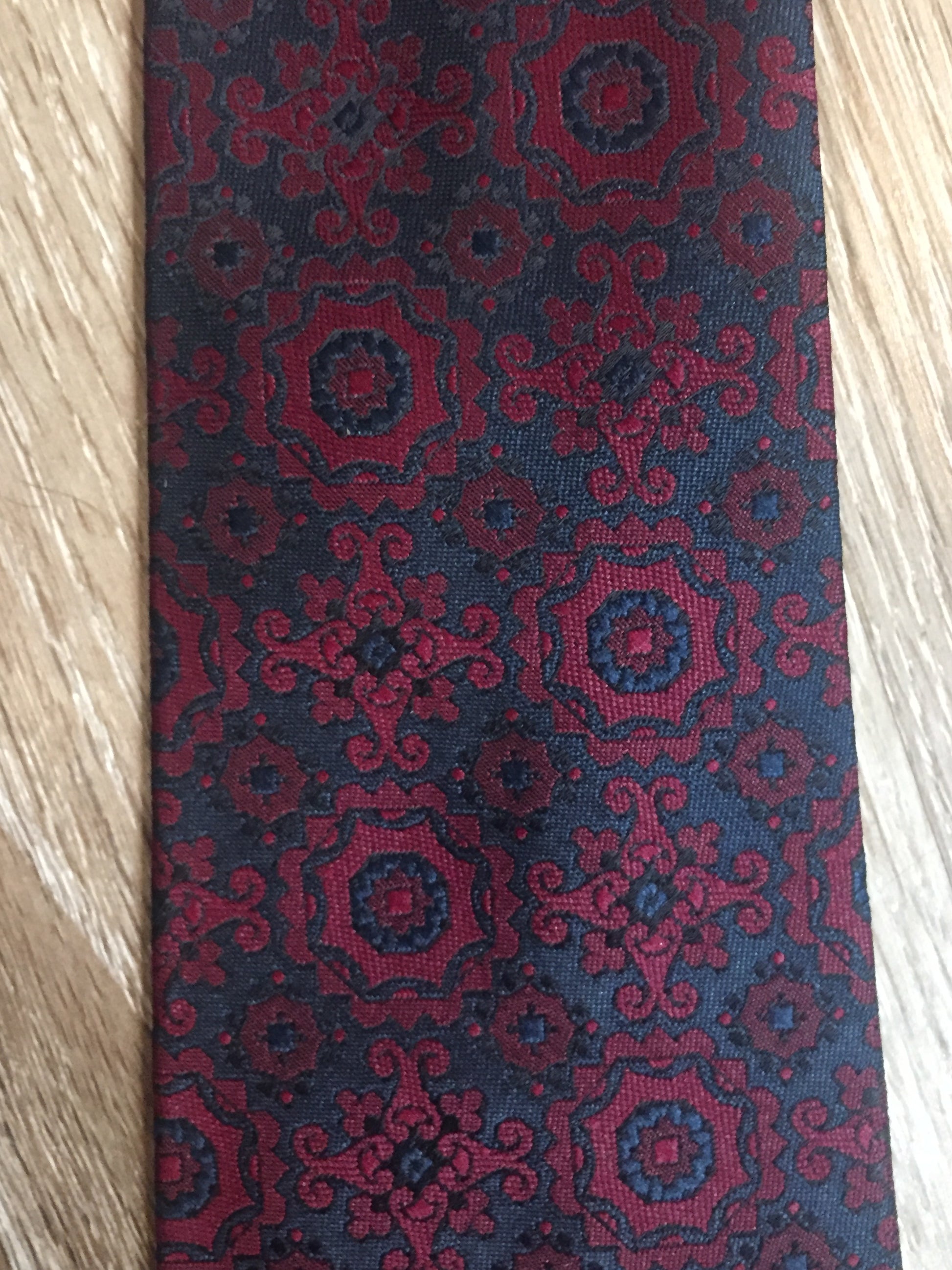 Kingspier Vintage - Harvey Gold tie in red and navy paisley design. Fibres unknown.
Length: 52.5” 
Width: 2.75” 
This tie is in excellent condition.