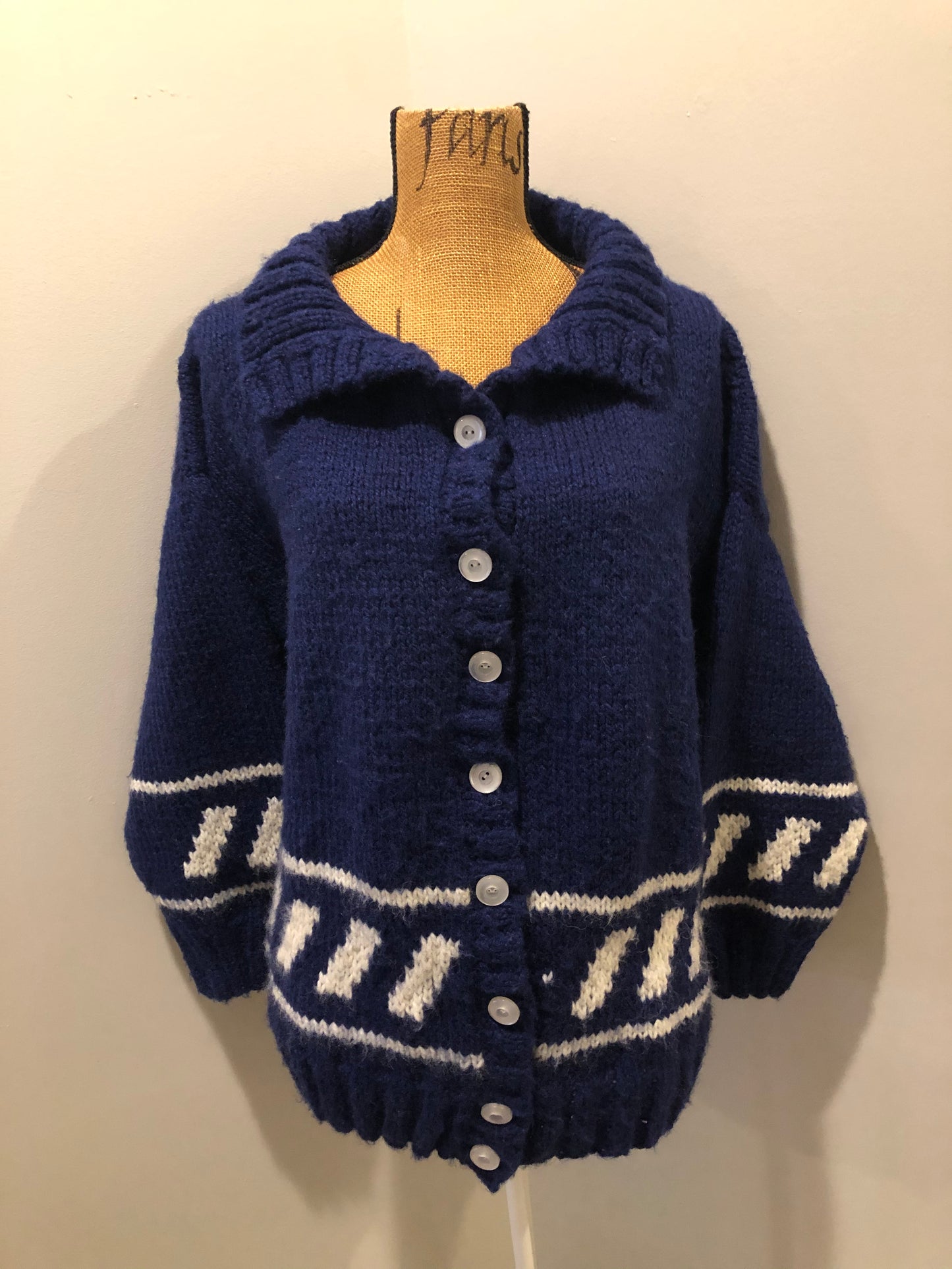 Kingspier Vintage - Hand knit royal blue cardigan with white design, collar and button closures. Made in Nova Scotia, Canada. Size large.