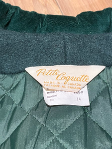 Vintage Coquette dark green wool/ nylon blend coat with button closures, two front pockets, quilted lining, velvet trim and a bow detail in the back.

Made in Canada
Size 14/ Chest 42”