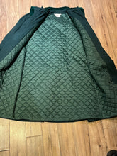 Load image into Gallery viewer, Vintage Coquette dark green wool/ nylon blend coat with button closures, two front pockets, quilted lining, velvet trim and a bow detail in the back.

Made in Canada
Size 14/ Chest 42”
