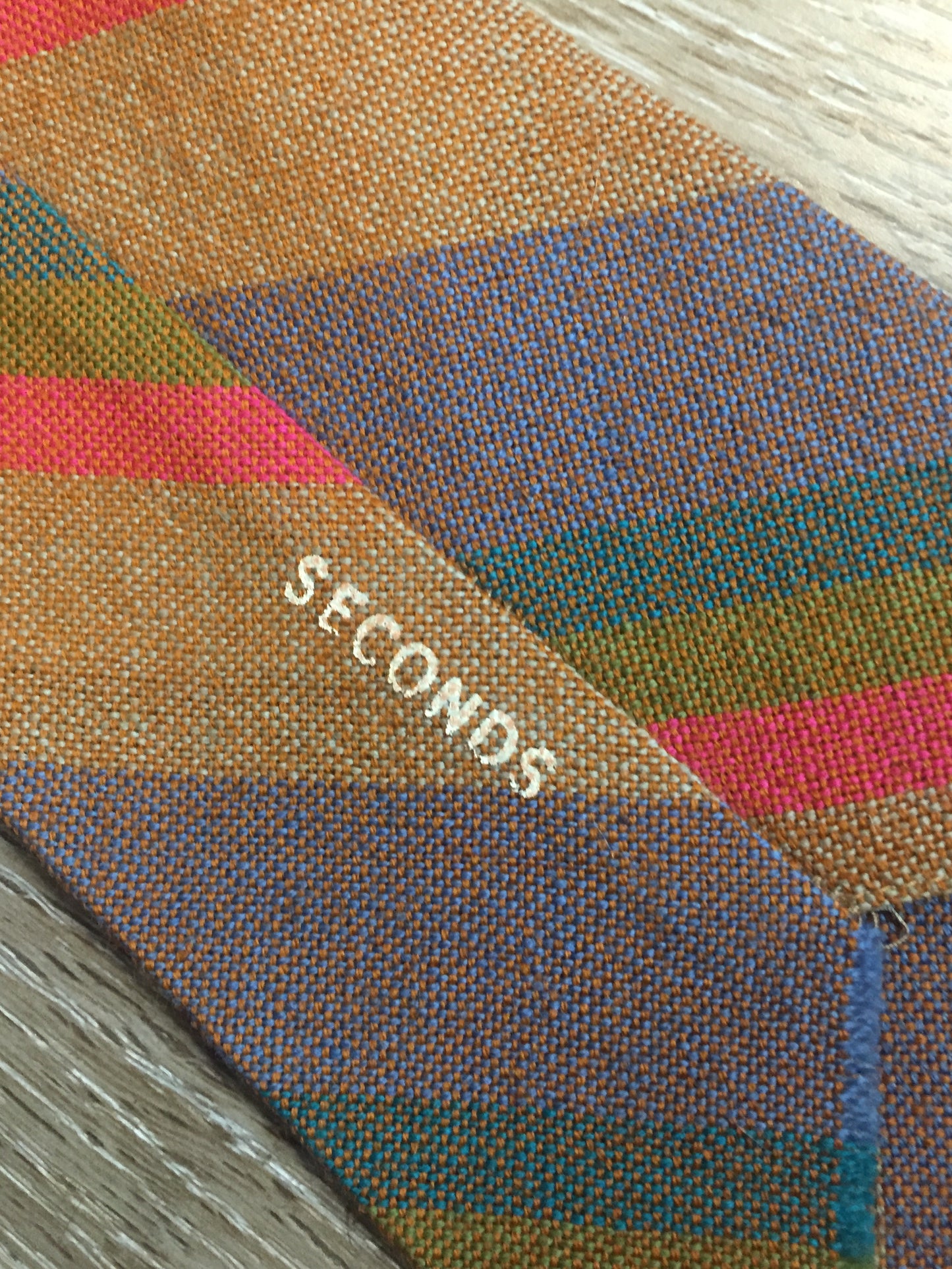 Kingspier Vintage - Seconds brown, orange, green and blue striped tie. Fibres unknown.
Length: 56”
Width: 4.25”
This tie is in excellent condition.