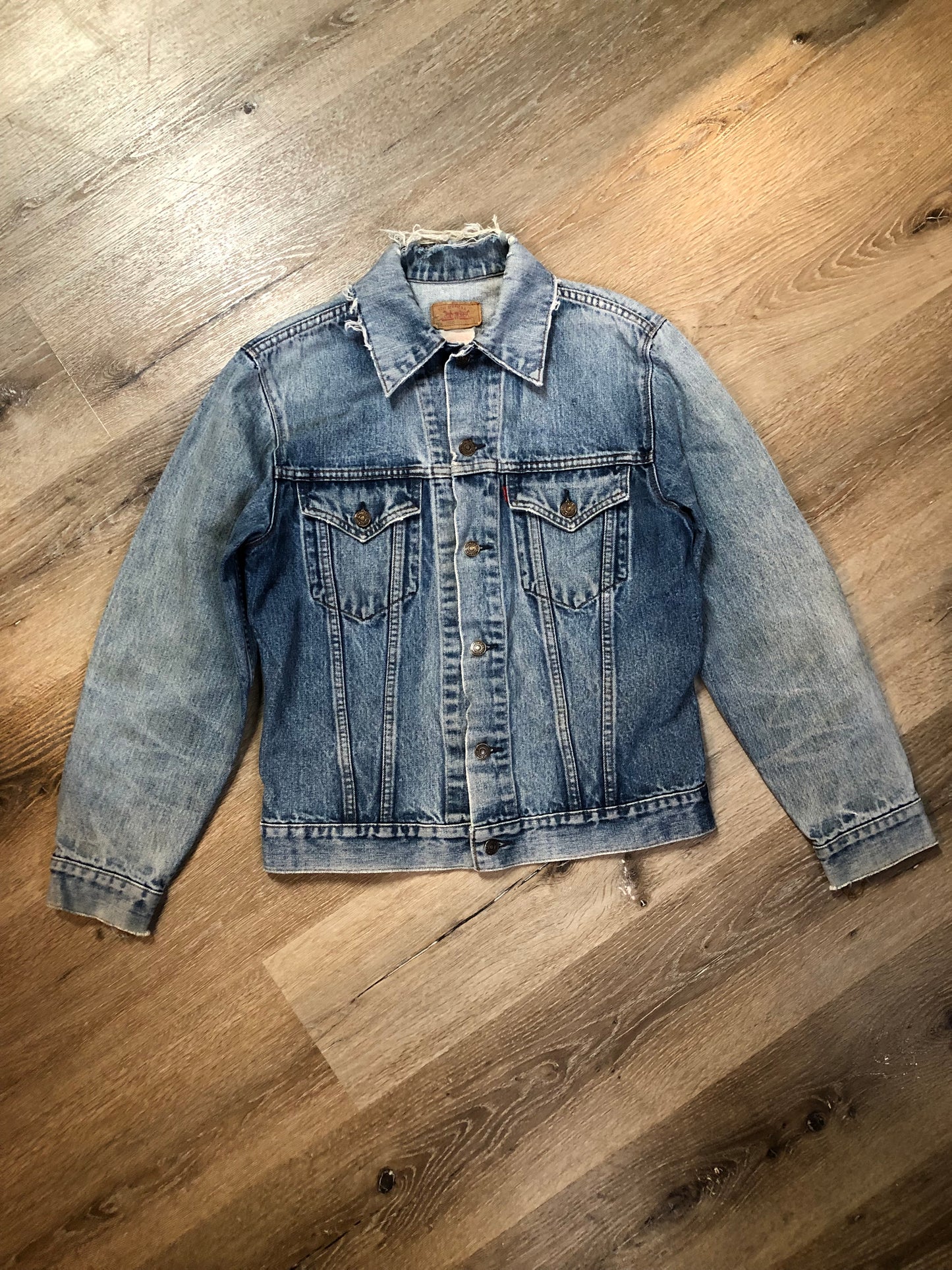 Vintage 1970’s Levi’s light wash denim trucker jacket with two flap pockets on the chest. Red Tab, 100% cotton, made in Canada, size 38 - Kingspier Vintage