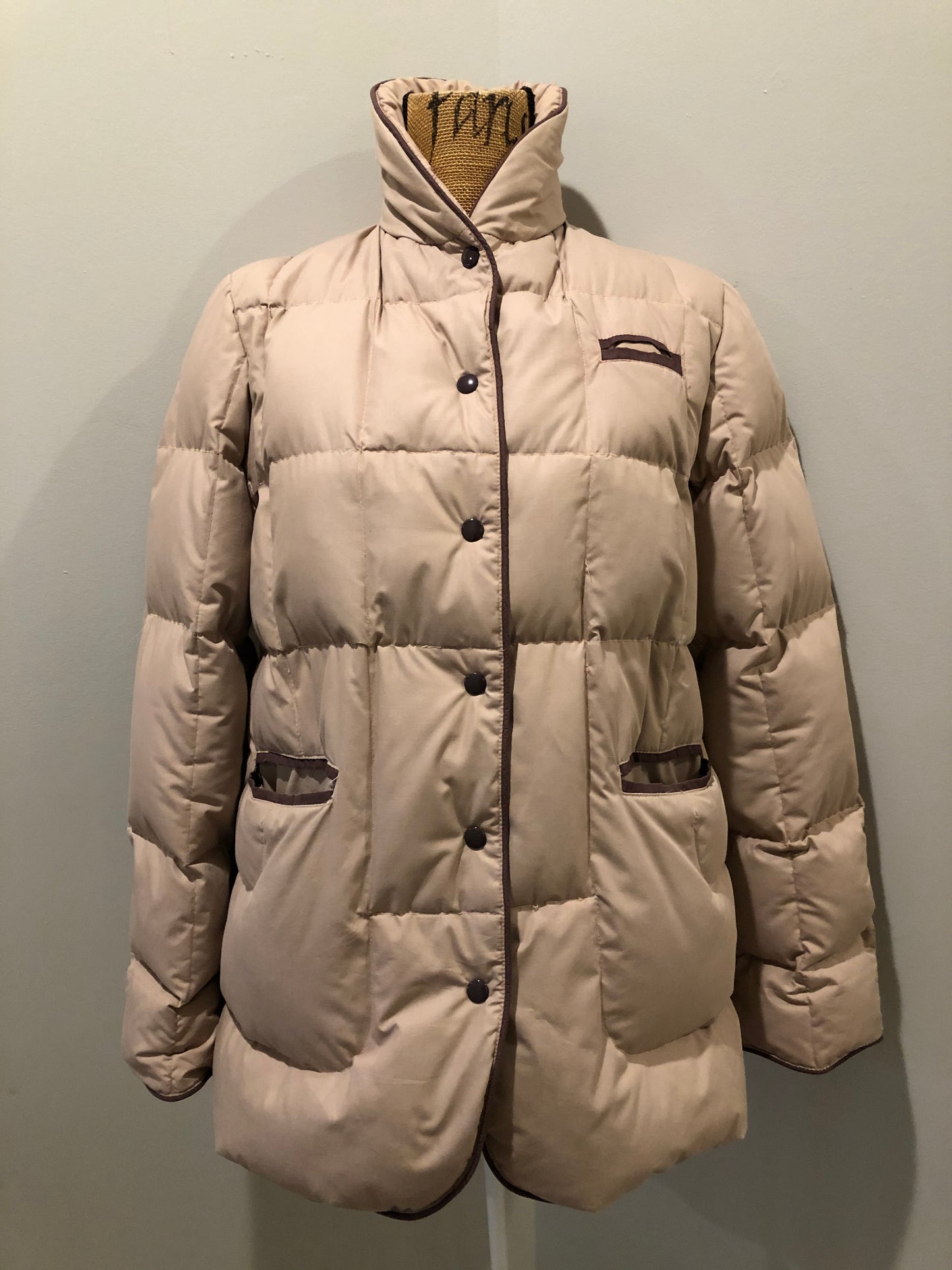 Kingspier Vintage - Vintage light pink down-filled puffer jacket with brown piping detail, snap closures, zipper closures and two welt pockets. Size 8.