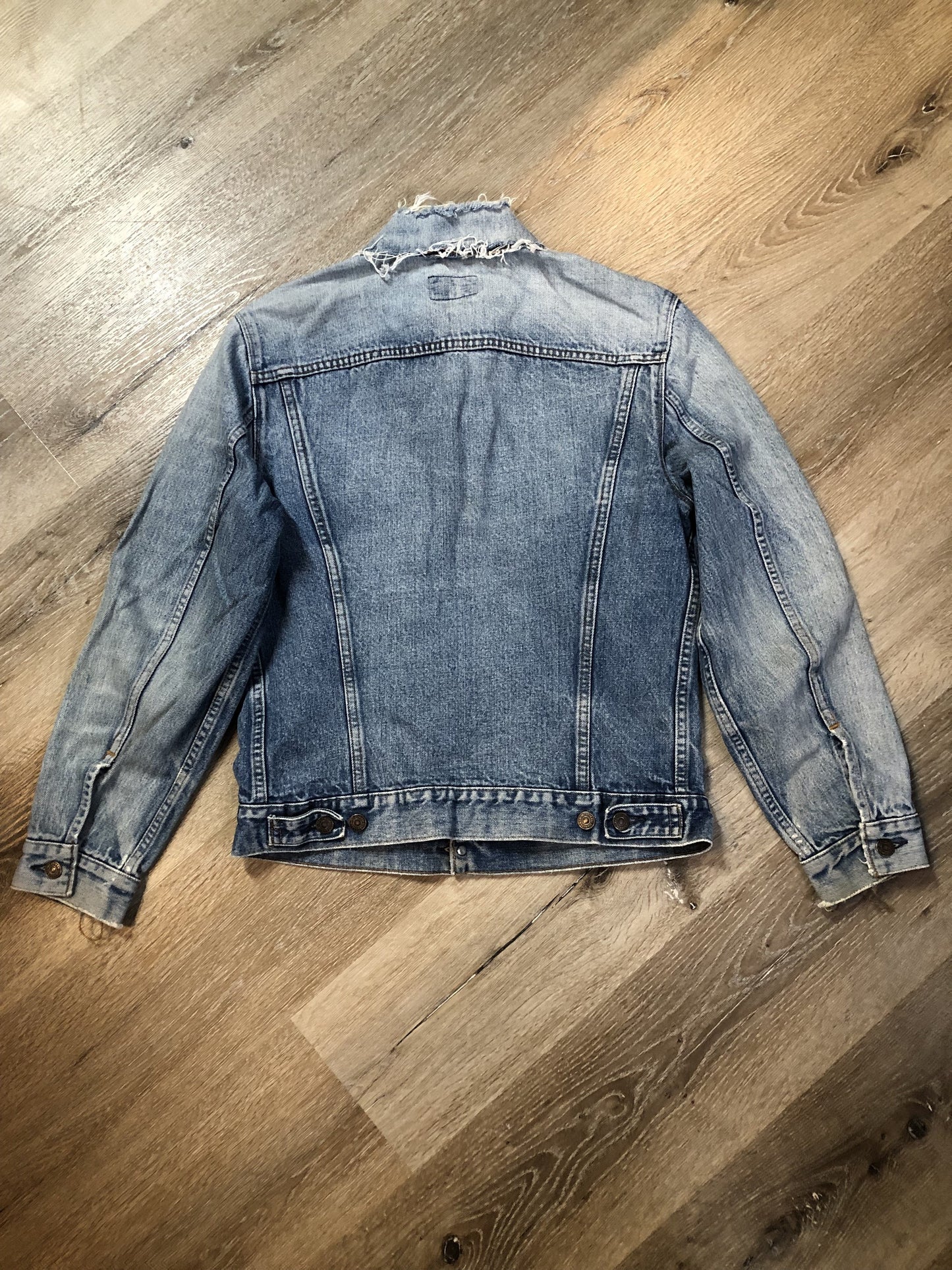 Vintage 1970’s Levi’s light wash denim trucker jacket with two flap pockets on the chest. Red Tab, 100% cotton, made in Canada, size 38 - Kingspier Vintage
