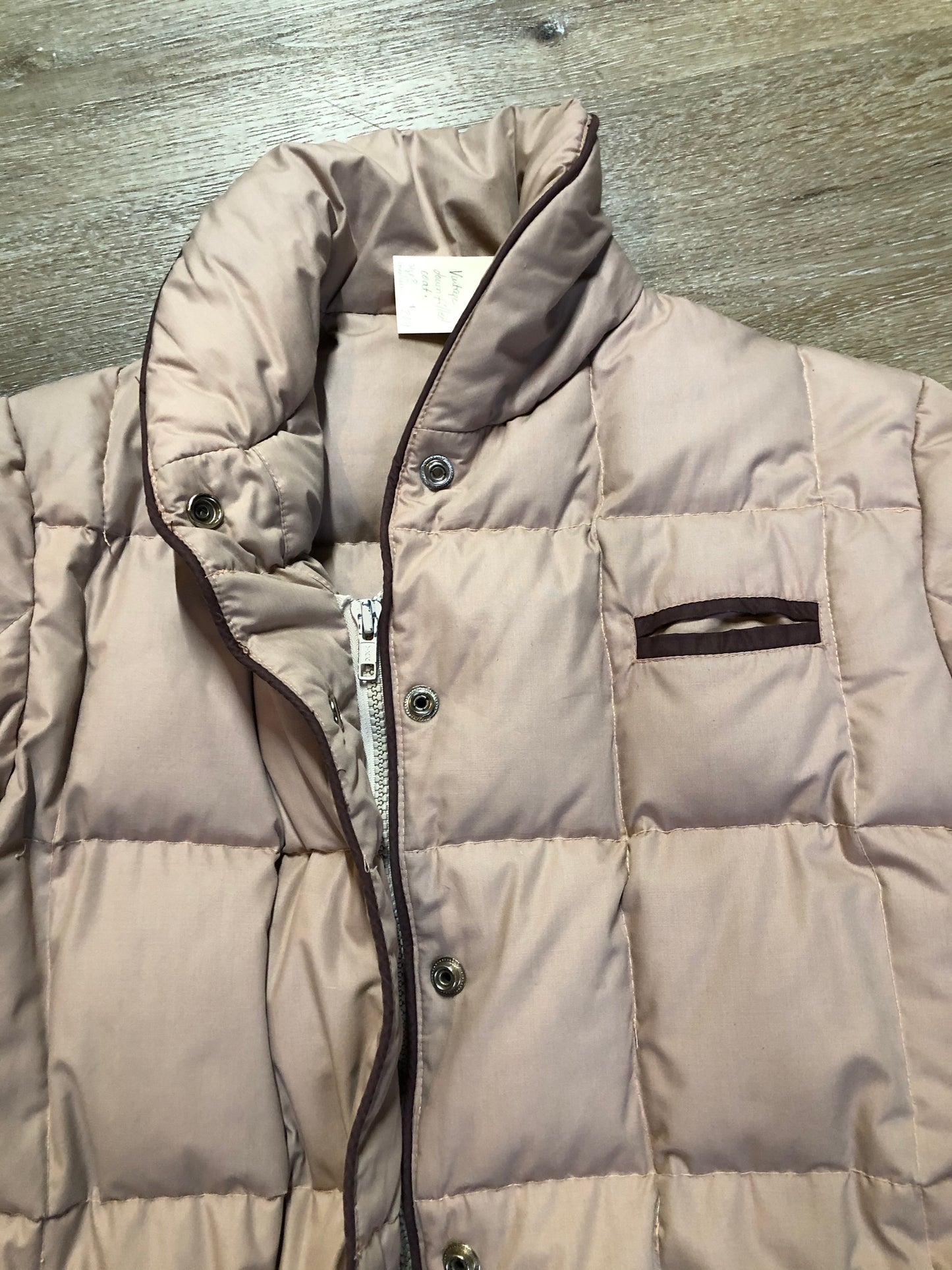 Kingspier Vintage - Vintage light pink down-filled puffer jacket with brown piping detail, snap closures, zipper closures and two welt pockets. Size 8.