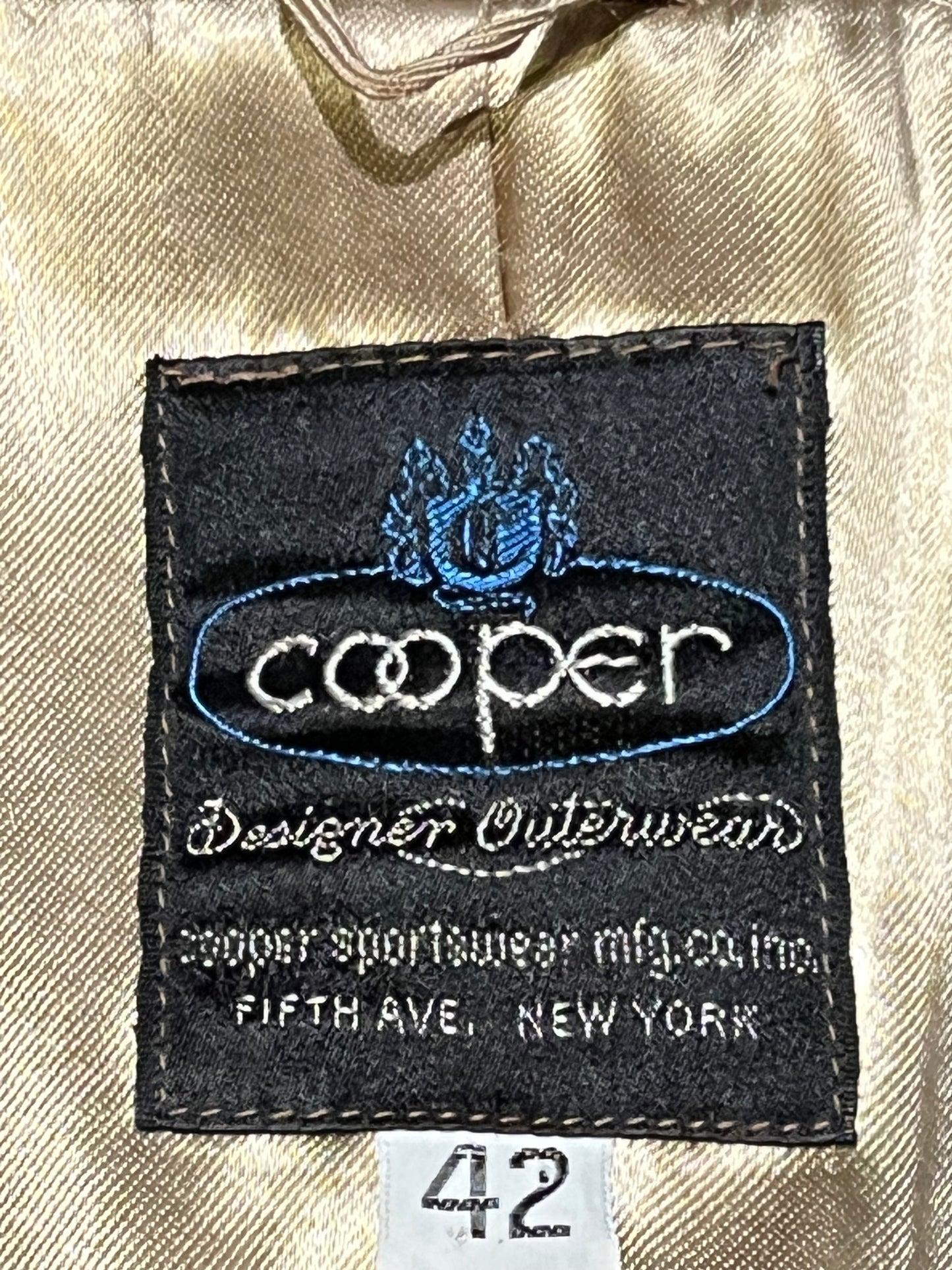 Vintage 70’s Cooper Sportswear camel brown trench coat with leather knot button closures, two front pockets and a satin lining.
Made in USA
Size 42