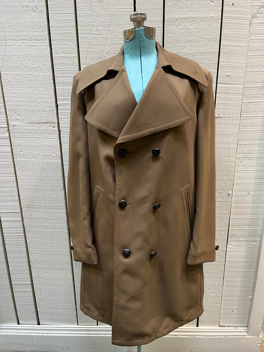 Vintage 70’s Cooper Sportswear camel brown trench coat with leather knot button closures, two front pockets and a satin lining.
Made in USA
Size 42