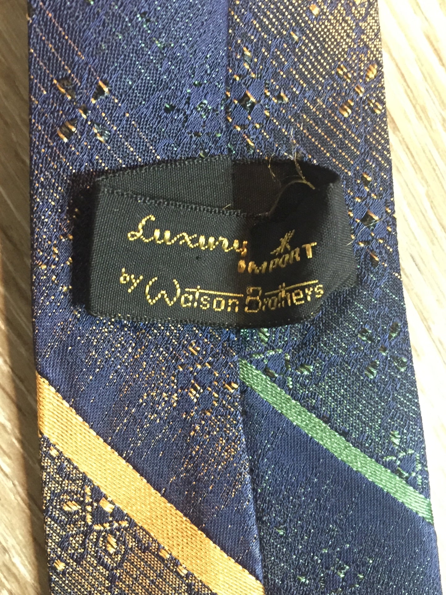 Kingspier Vintage - Vintage Watson Bros blue with green and orange diagonal stripe tie.
Length: 66”
Width: 2.5”
This tie is in excellent condition.