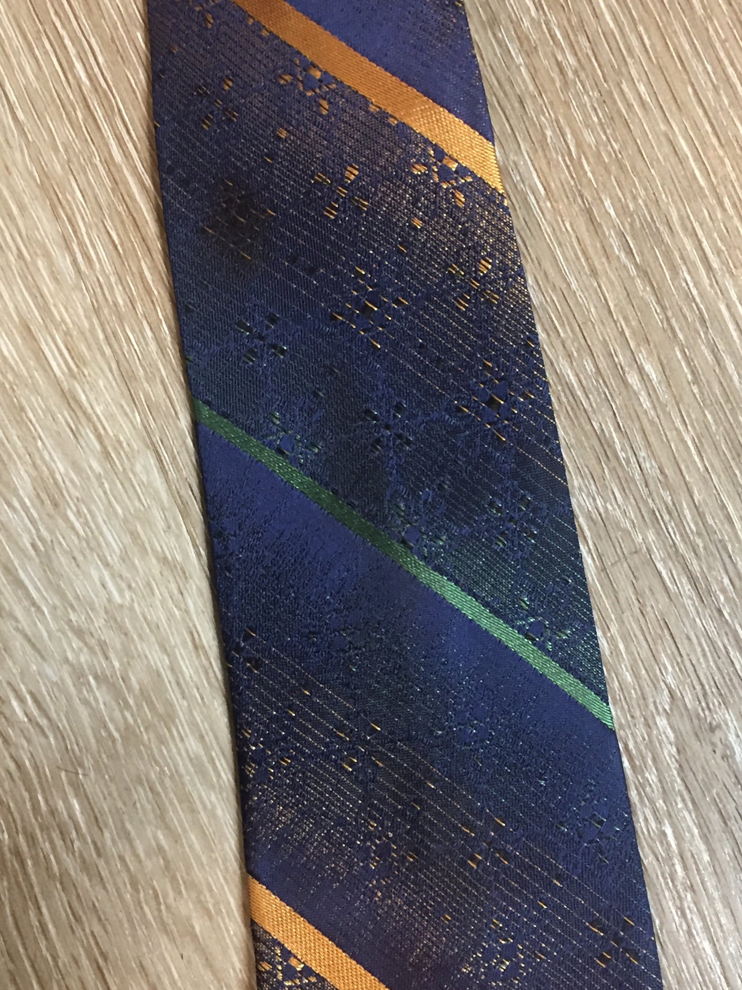 Kingspier Vintage - Vintage Watson Bros blue with green and orange diagonal stripe tie.
Length: 66”
Width: 2.5”
This tie is in excellent condition.