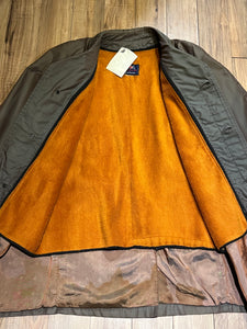 Vintage Centennial Sportswear toupe trench coat with removable orange lining, button closures and two front pockets.

Made in Canada
Chest 46”
